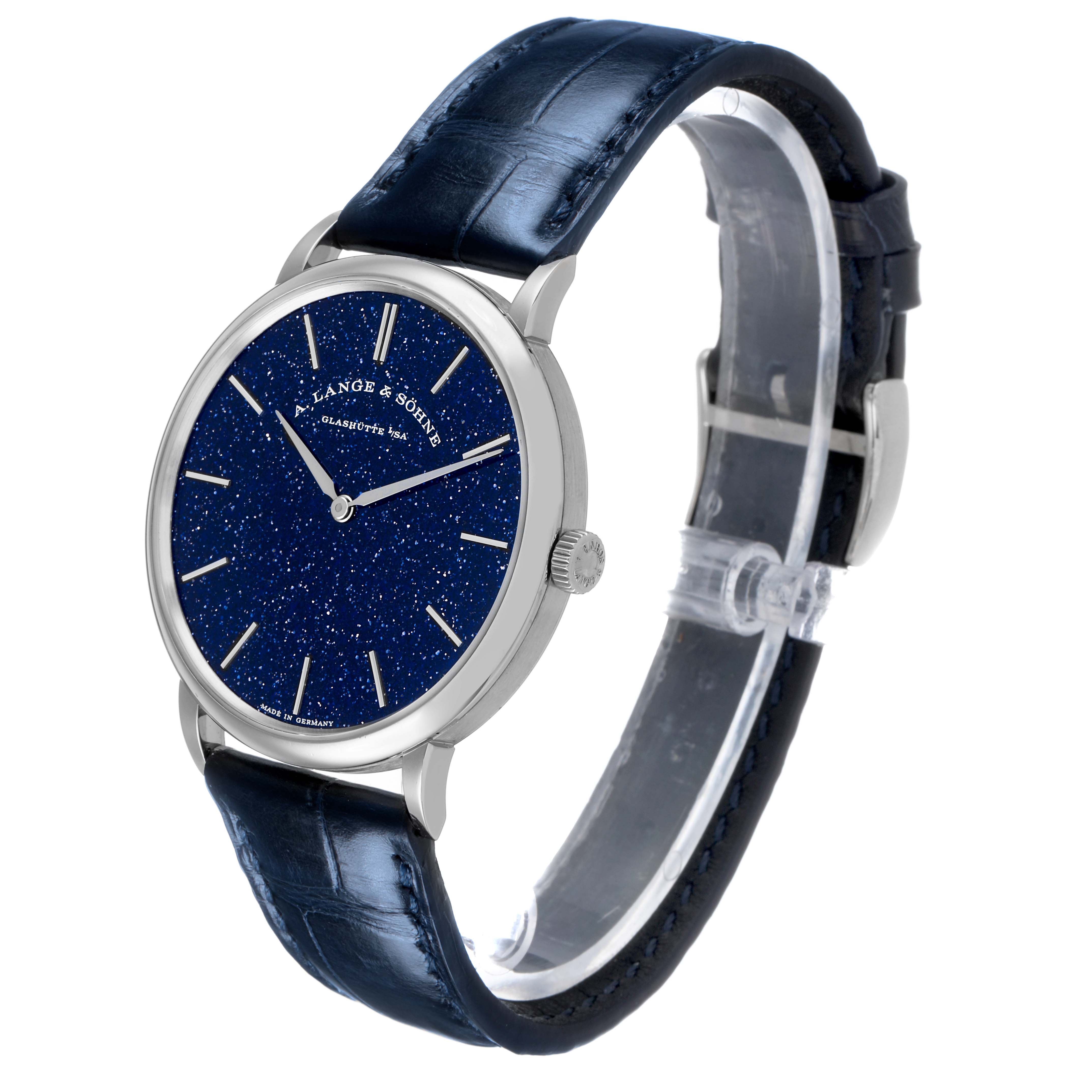 The A. Lange & Sohne Saxonia 205.086 / LSLS2053AX Men's White Gold Blue Dial watch is shown at a three-quarter angle, highlighting the face, bezel, crown, and strap.