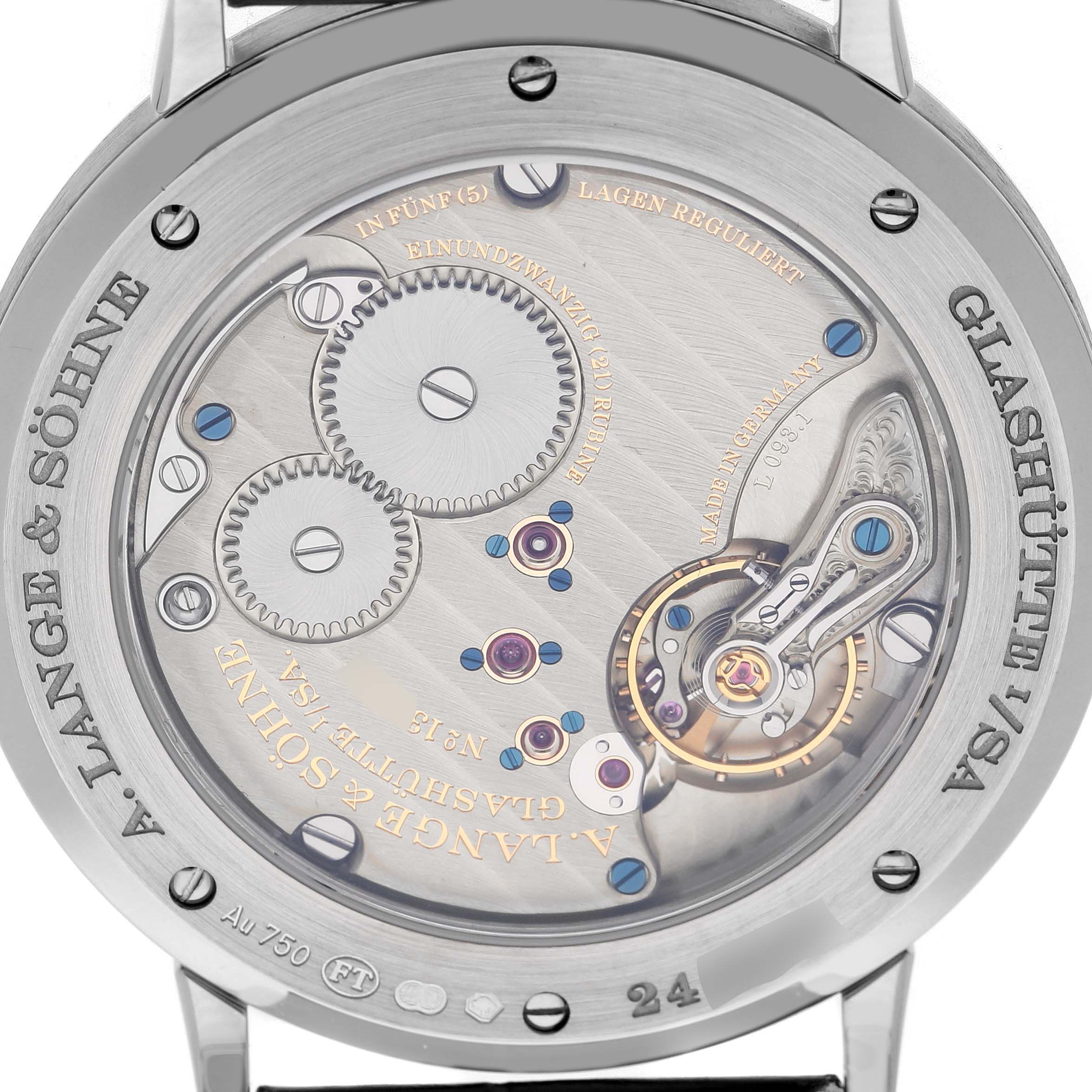 The image shows the back view of the A. Lange & Sohne Saxonia 205.086 / LSLS2053AX Men's White Gold Blue Dial, displaying its intricate movement and visible gears.