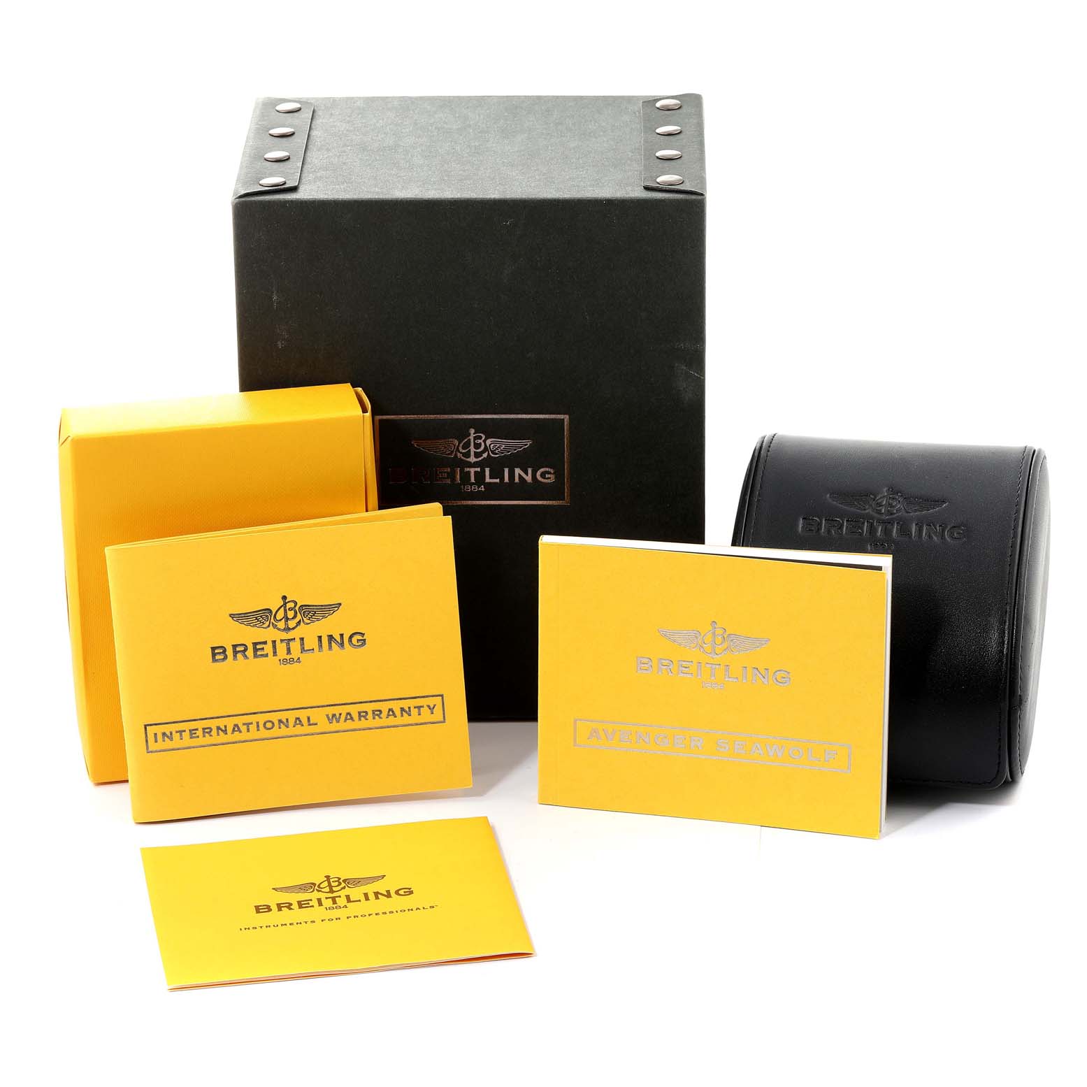 The image shows the packaging, manuals, and warranty cards for a Breitling Avenger A17330 Men's Stainless Steel Black Dial A17330 Men's Stainless Steel Black Dial watch.