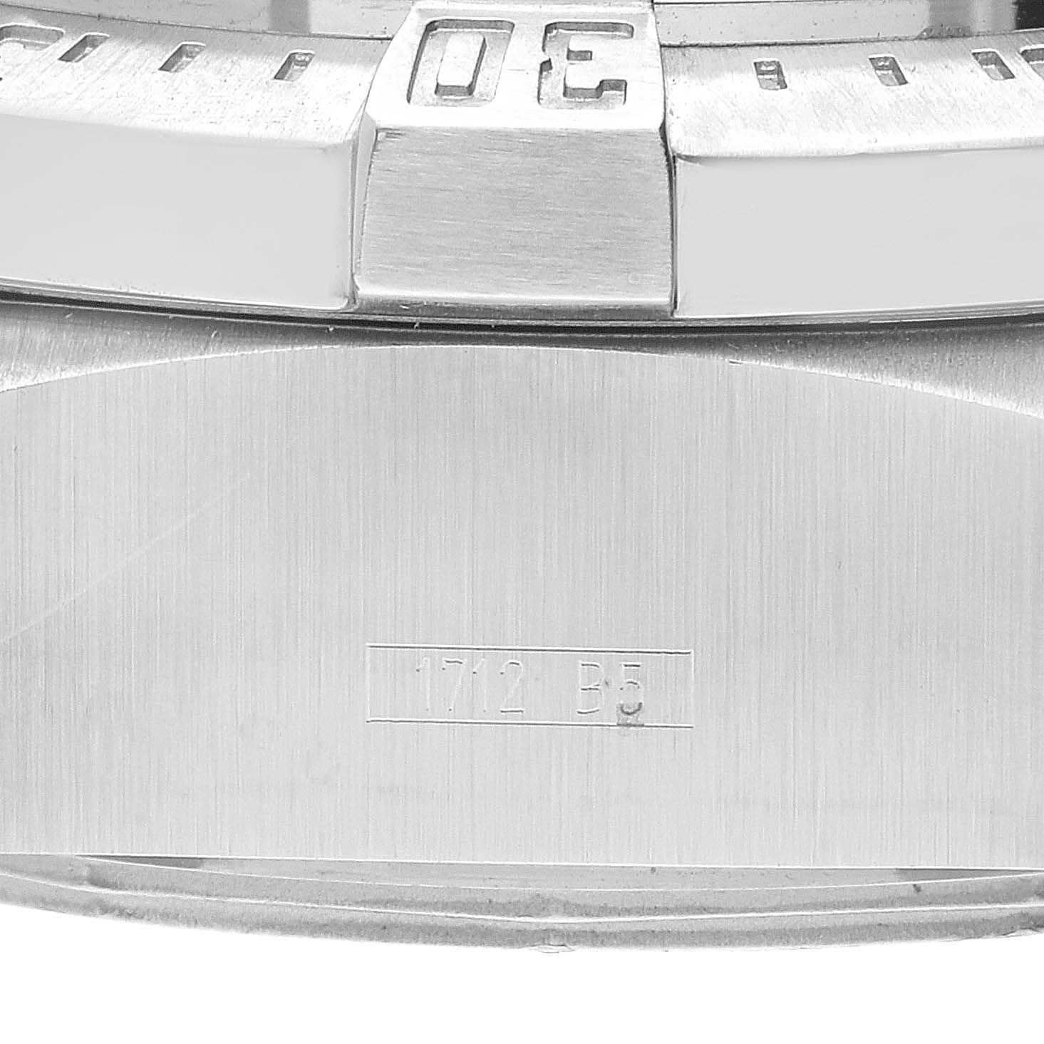 This close-up shows the bezel and a portion of the case of a Breitling Avenger A17330 Men's Stainless Steel Black Dial A17330 Men's Stainless Steel Black Dial watch, including a visible serial number.