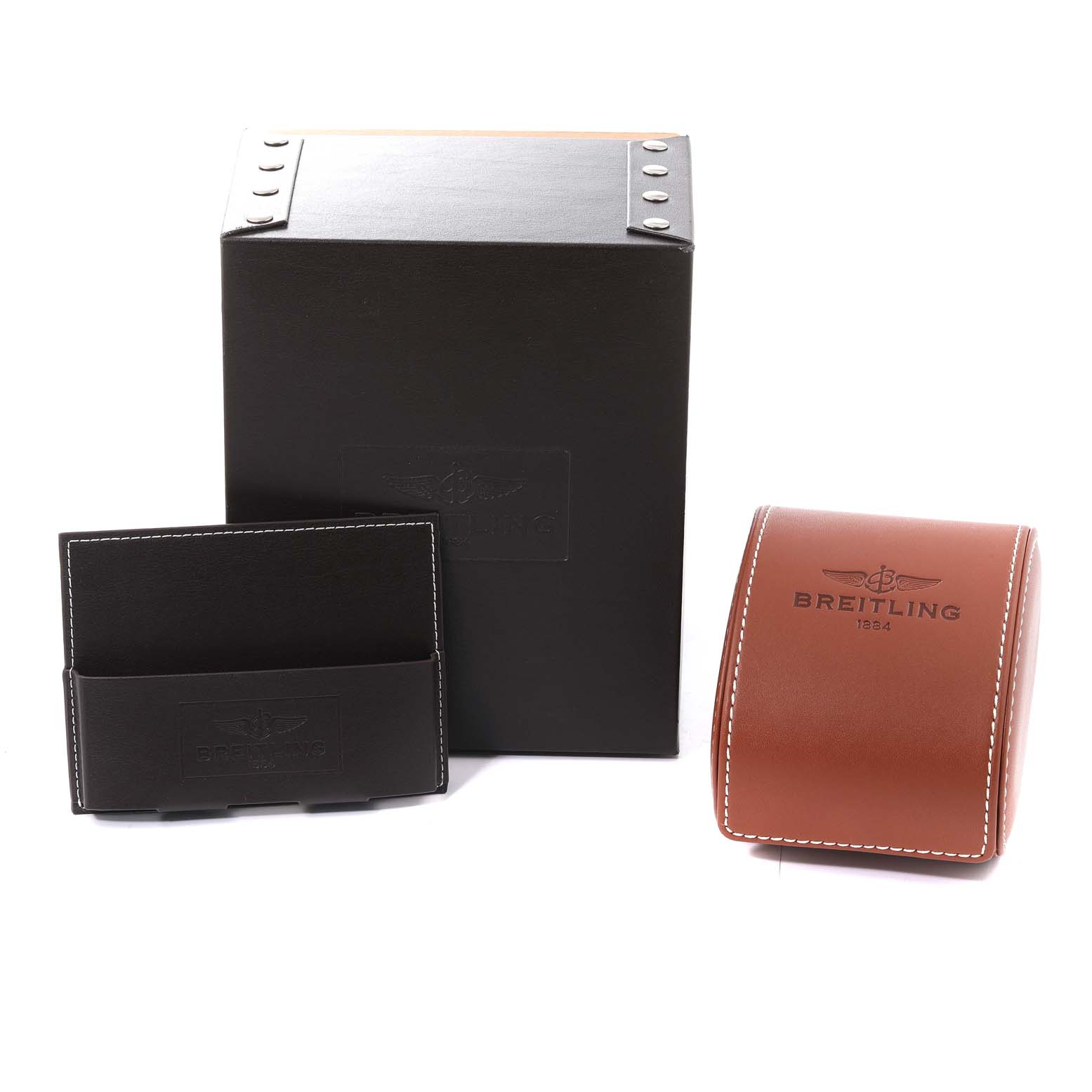 The image shows the packaging and case accessories for a Breitling Superocean A17390 Men's Stainless Steel Silver Dial A17390 Men's Stainless Steel Silver Dial watch, including a box, card holder, and leather watch case.