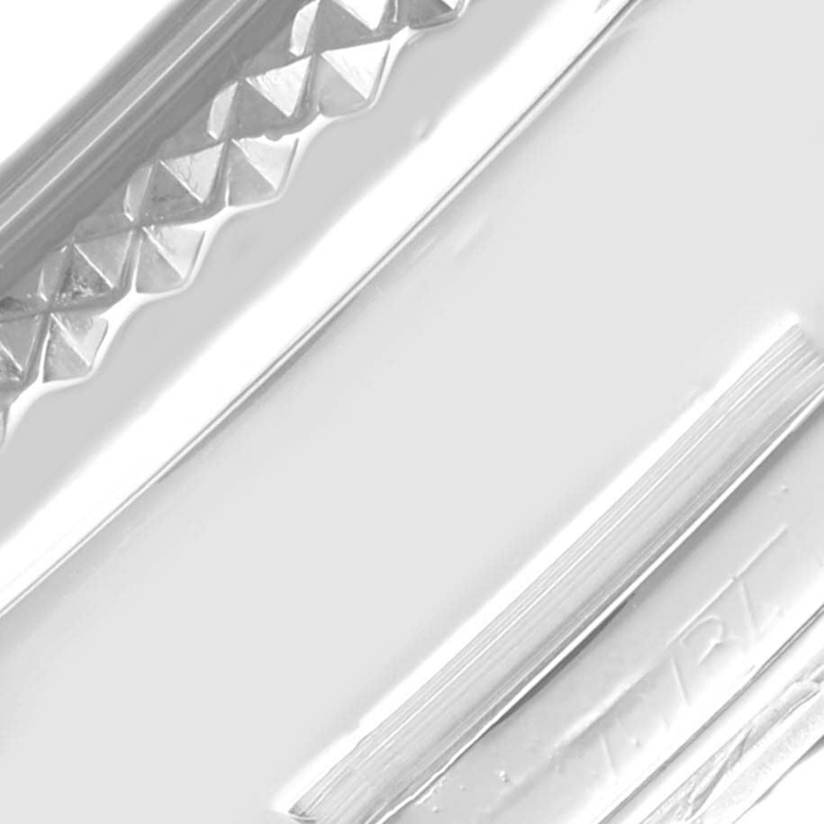 The image shows a close-up of the textured metal surface, likely part of the bezel, from the Breitling Bentley P26362 Men's Stainless Steel Blue Dial P26362 Men's Stainless Steel Blue Dial model.