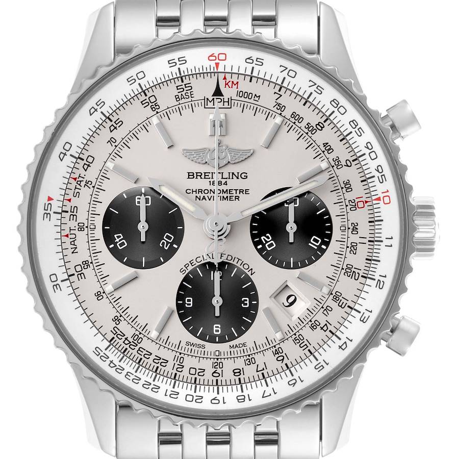 The Breitling Navitimer watch is shown from a frontal angle, highlighting its dial, bezel, and chronograph subdials.