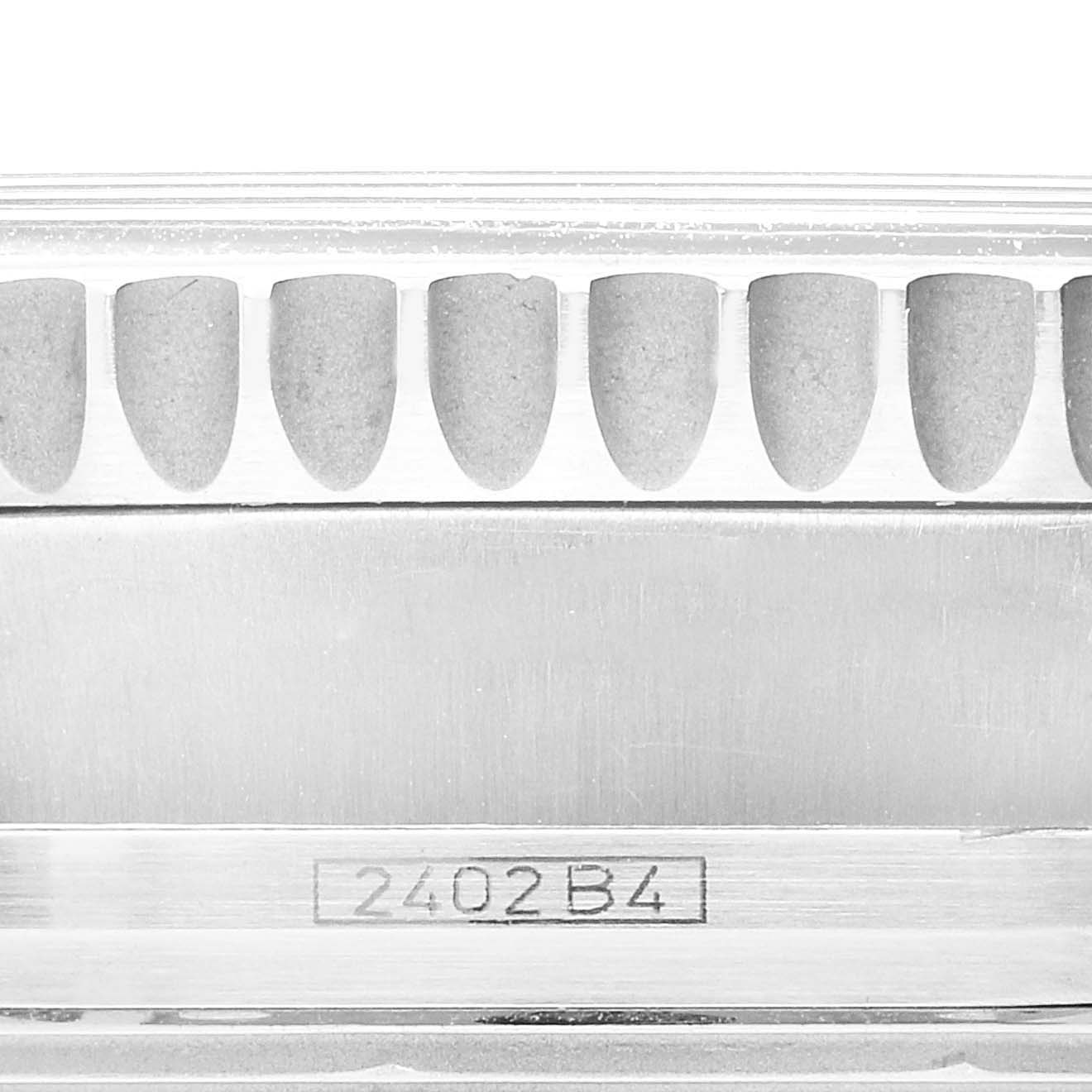 This image shows a close-up of the serial number and serrated bezel edge of a Breitling Navitimer A13330 Men
s Stainless Steel Black Dial A13330 Men
s Stainless Steel Black Dial watch.