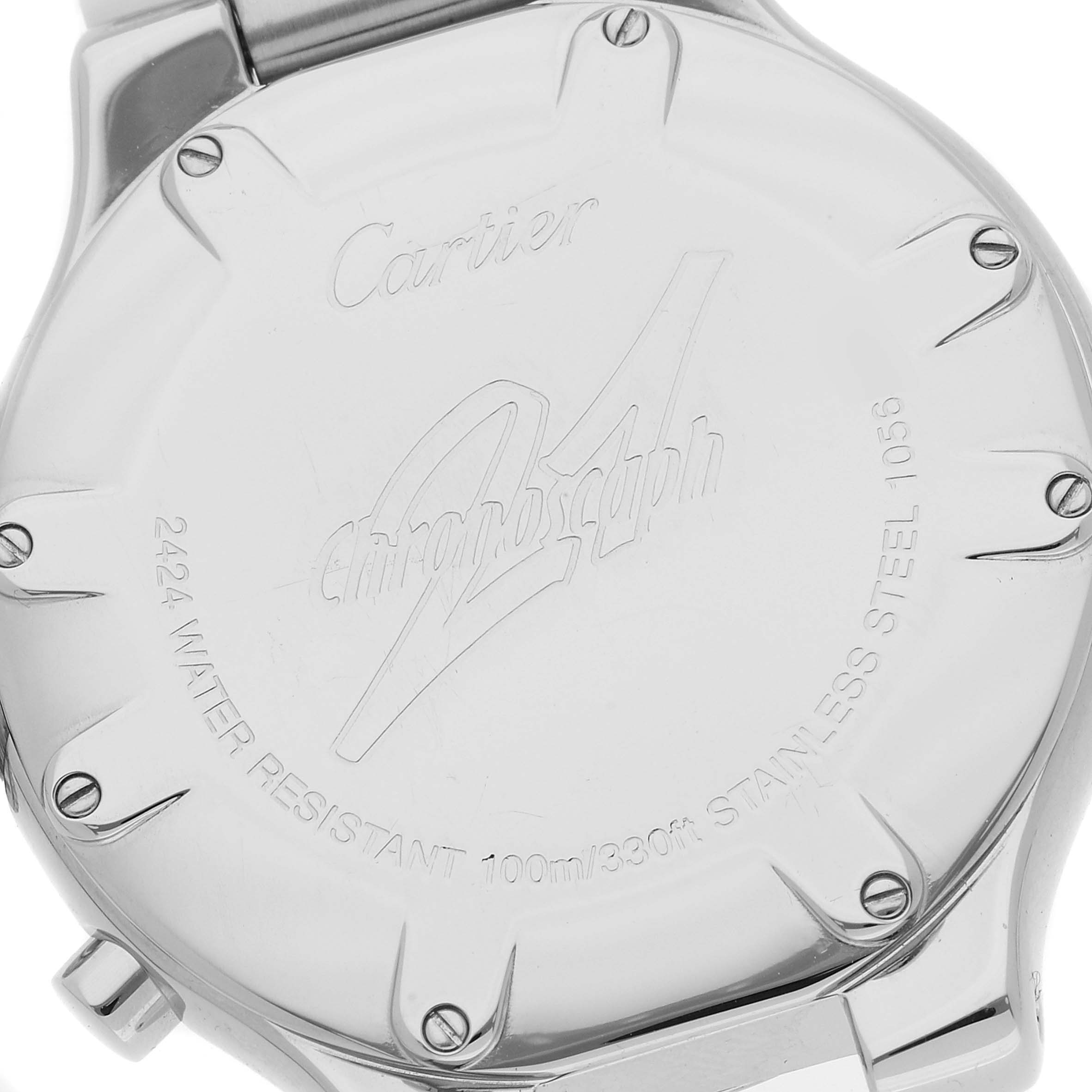 The image shows the back case of a Must 21 model by Cartier, highlighting its inscriptions and screw details.