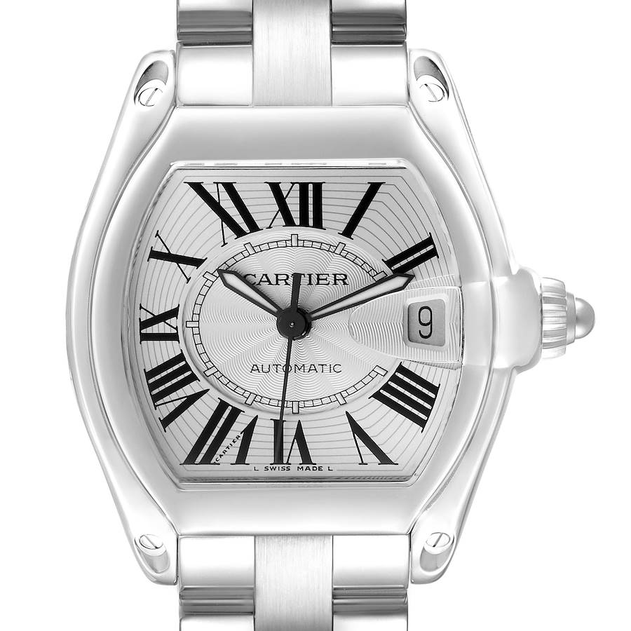 The Cartier Roadster watch is shown from a front angle, highlighting the face, Roman numerals, date window, and bracelet.