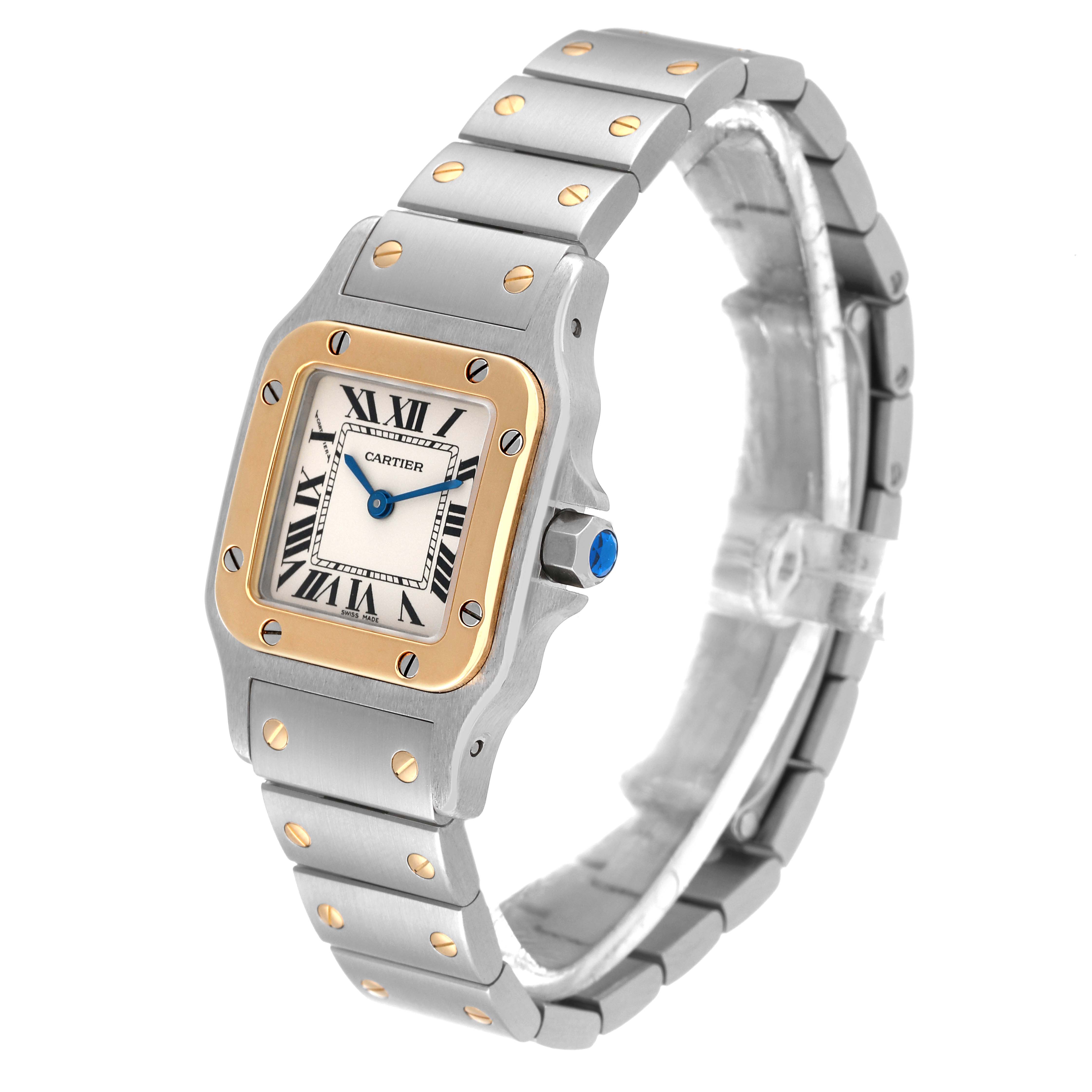 The image shows a Cartier Santos W20012C4 Women's Steel and Gold (two tone) Silver Dial W20012C4 Women's Steel and Gold (two tone) Silver Dial watch angled to display the face, bezel, and part of the bracelet.