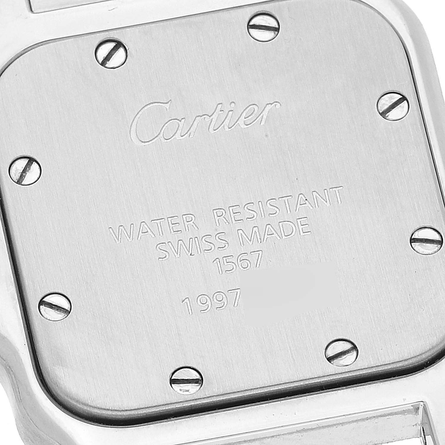 The image shows the back casing of a Cartier Santos W20012C4 Women's Steel and Gold (two tone) Silver Dial W20012C4 Women's Steel and Gold (two tone) Silver Dial watch, highlighting the brand's engraving and screw details.