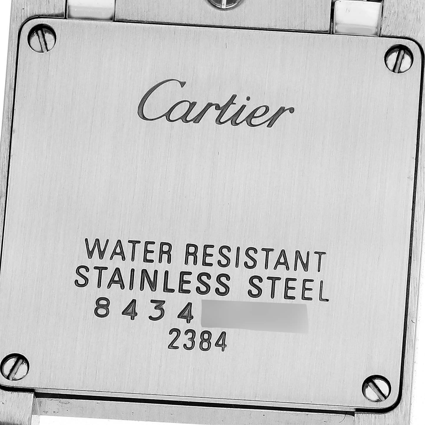 The image shows the back case of a Cartier Tank Francaise W51027Q4 Women's Steel and Gold (two tone) Mother of Pearl Dial W51027Q4 Women's Steel and Gold (two tone) Mother of Pearl Dial watch, displaying branding and specifications.