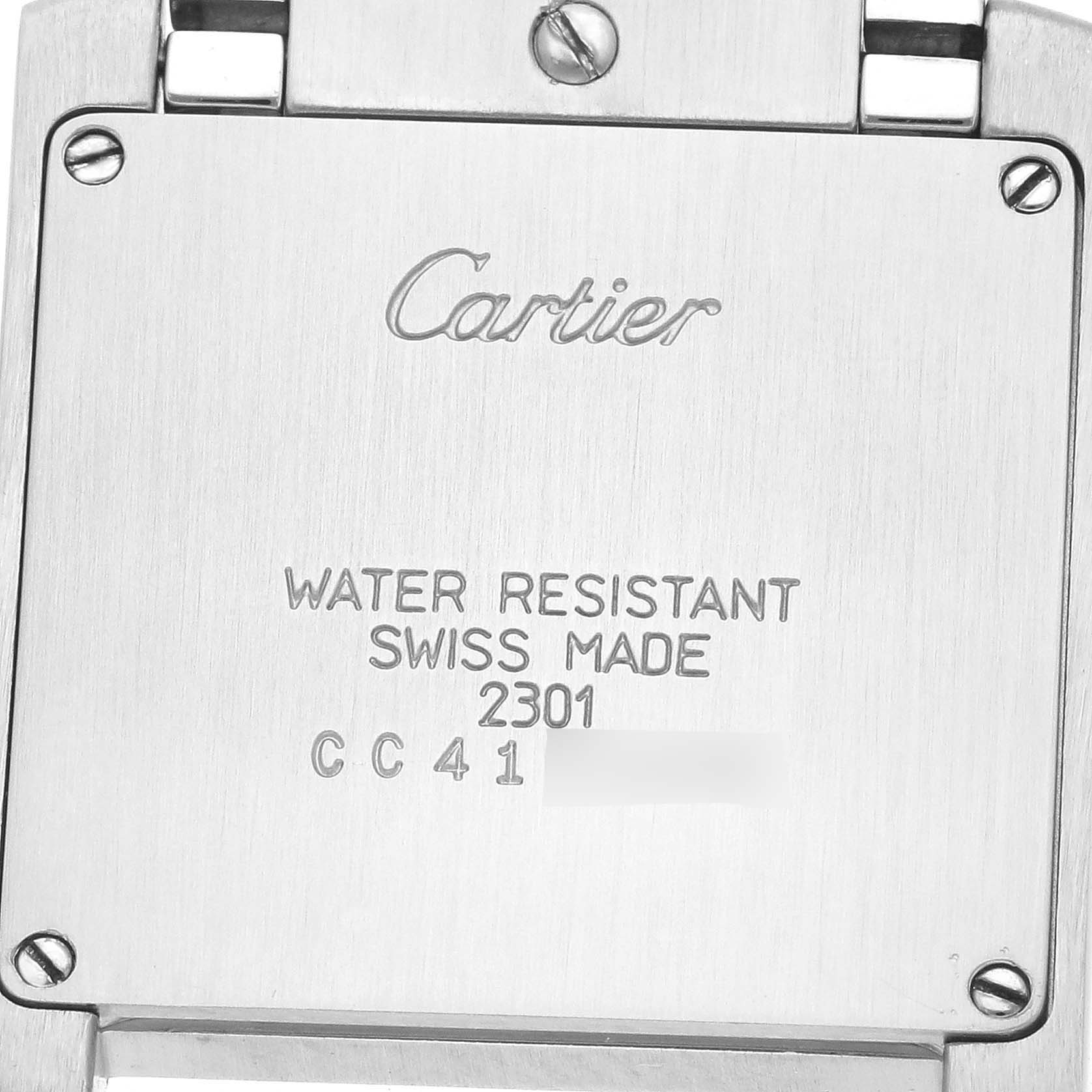 The image shows the back of a Cartier Tank Française watch, highlighting engravings and screws.