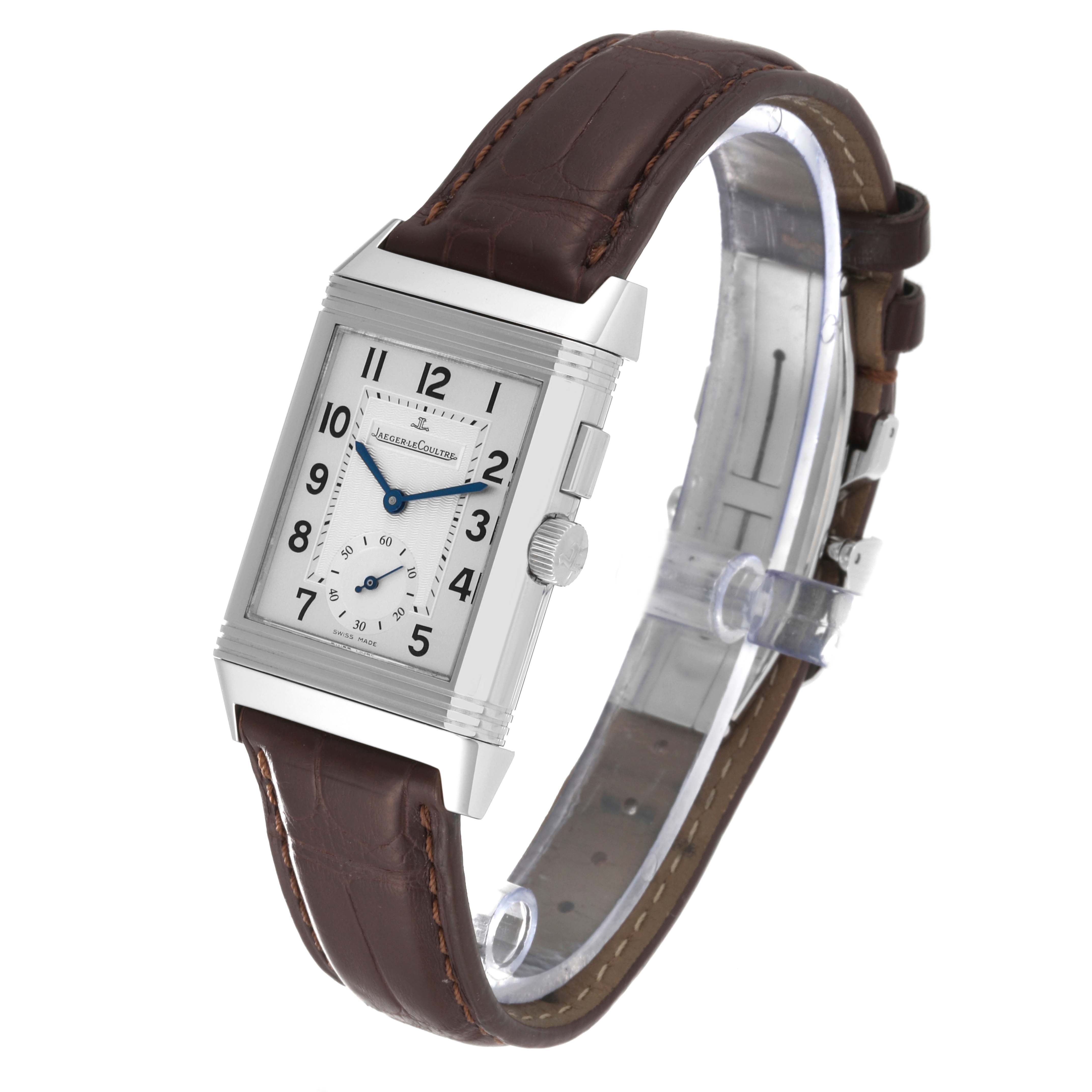 The image shows a Jaeger LeCoultre Reverso Q2718410 Men's Stainless Steel Silver Dial Q2718410 Men's Stainless Steel Silver Dial watch at a slight side angle, displaying its rectangular face and brown leather strap.