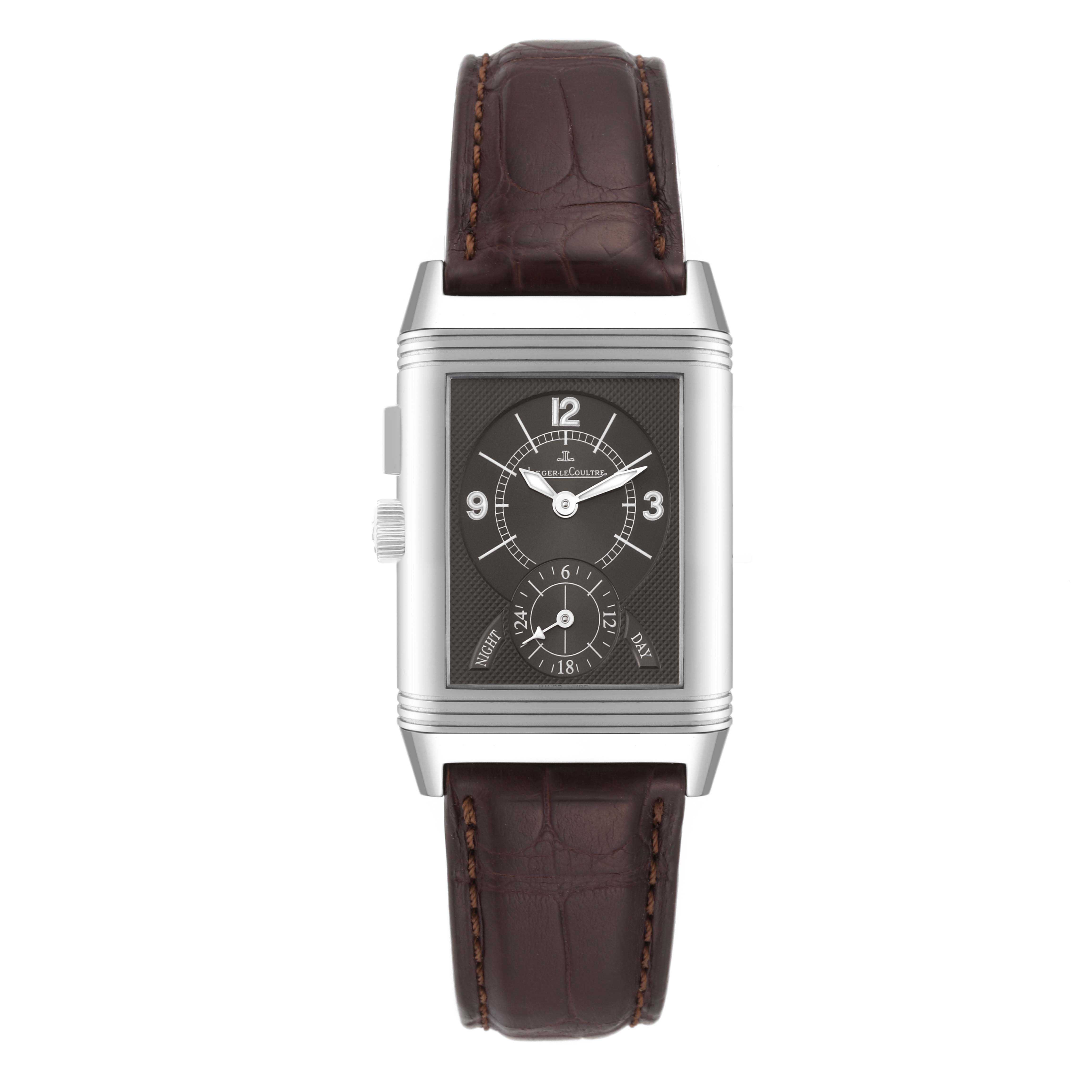 The Jaeger LeCoultre Reverso Q2718410 Men's Stainless Steel Silver Dial Q2718410 Men's Stainless Steel Silver Dial watch is shown from a front angle, displaying the dial, case, crown, and leather strap.