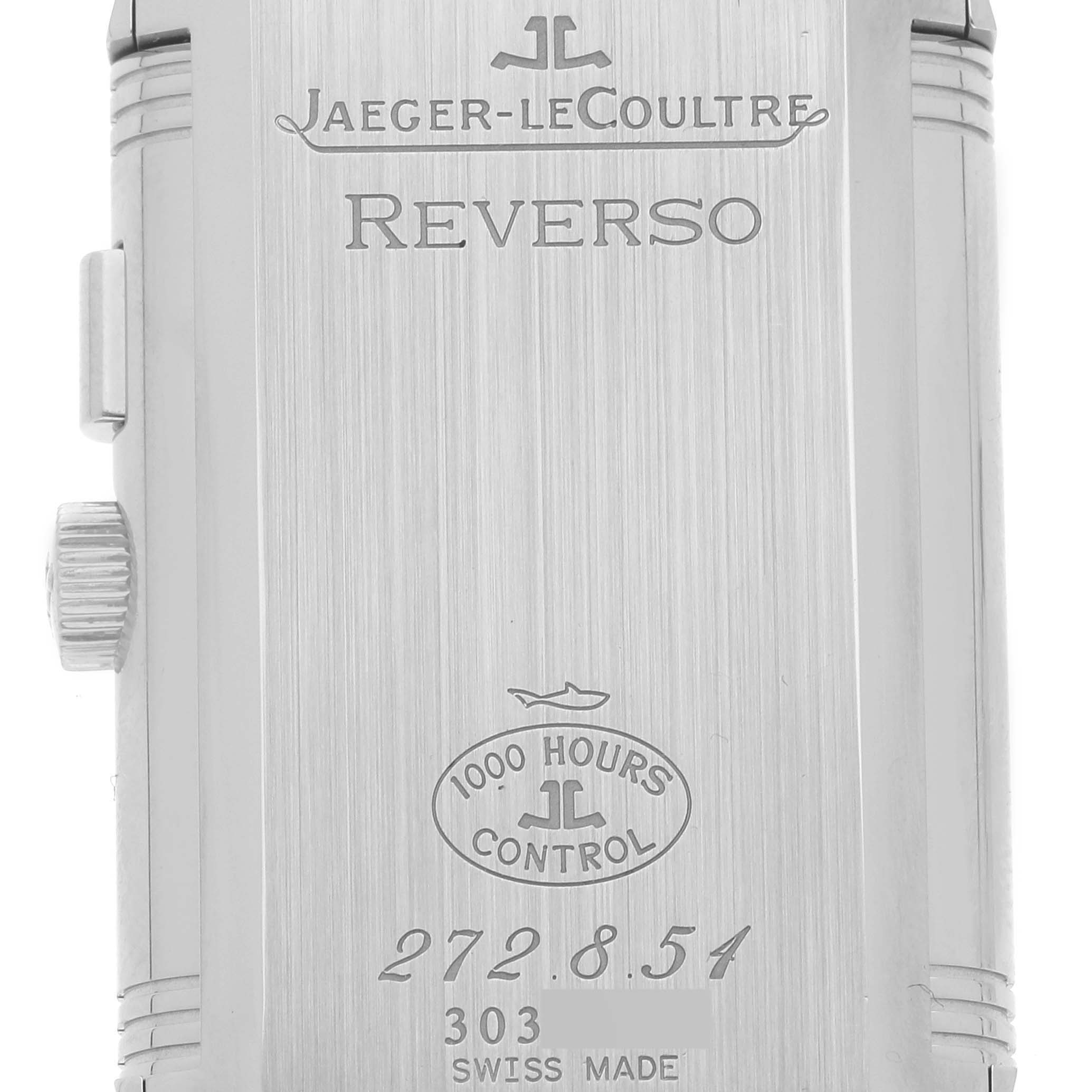 This image shows the back case of a Jaeger-LeCoultre Reverso watch, highlighting the brand's engravings and control stamp.