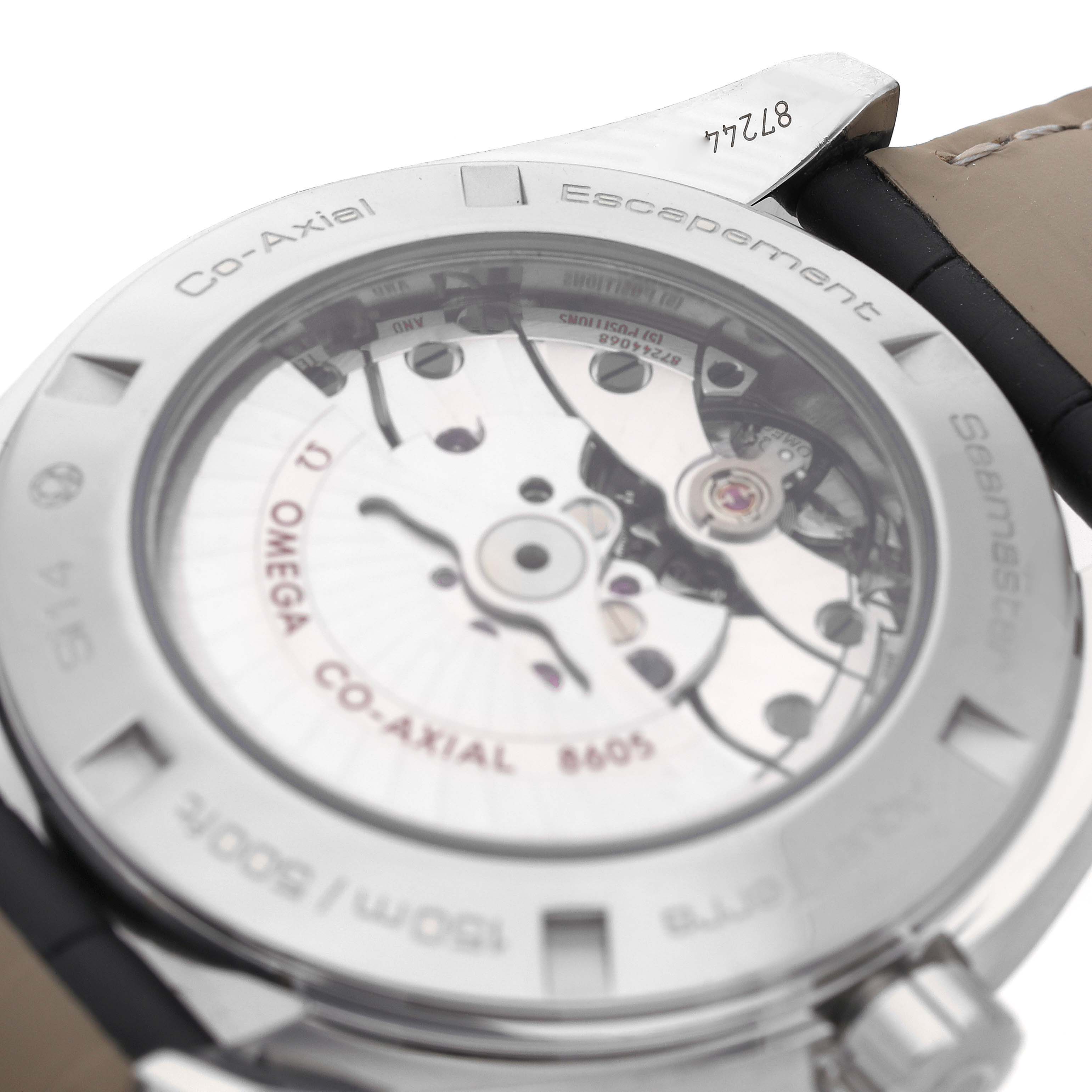 The image shows the back of an Omega Aqua Terra 231.13.43.22.01.001 Men's Stainless Steel Black Dial 231.13.43.22.01.001 Men's Stainless Steel Black Dial watch, highlighting its Co-Axial escapement mechanism.