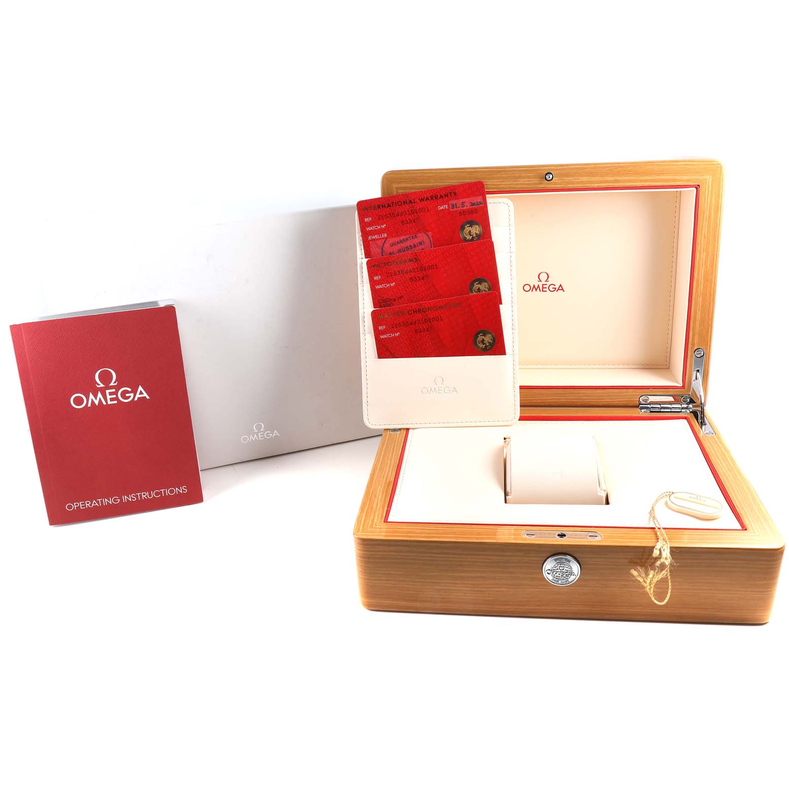 This image shows the packaging, warranty cards, and instruction booklet for the Omega Planet Ocean 215.30.44.21.01.001 Men
s Stainless Steel Black Dial 215.30.44.21.01.001 Men
s Stainless Steel Black Dial watch.