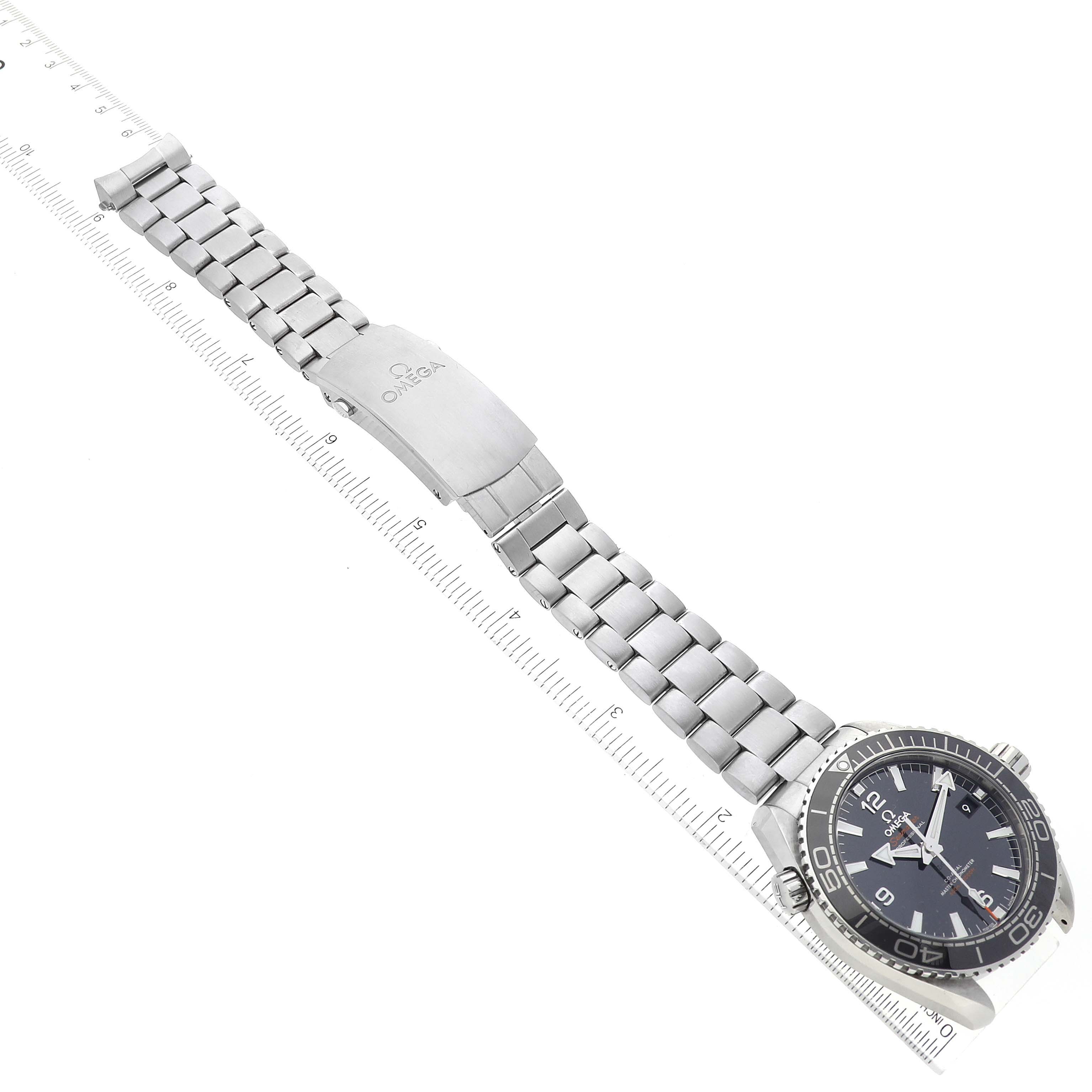 The image shows an Omega Planet Ocean 215.30.44.21.01.001 Men
s Stainless Steel Black Dial 215.30.44.21.01.001 Men
s Stainless Steel Black Dial watch at an angle displaying the face, bezel, hour markers, and metal bracelet with clasp.