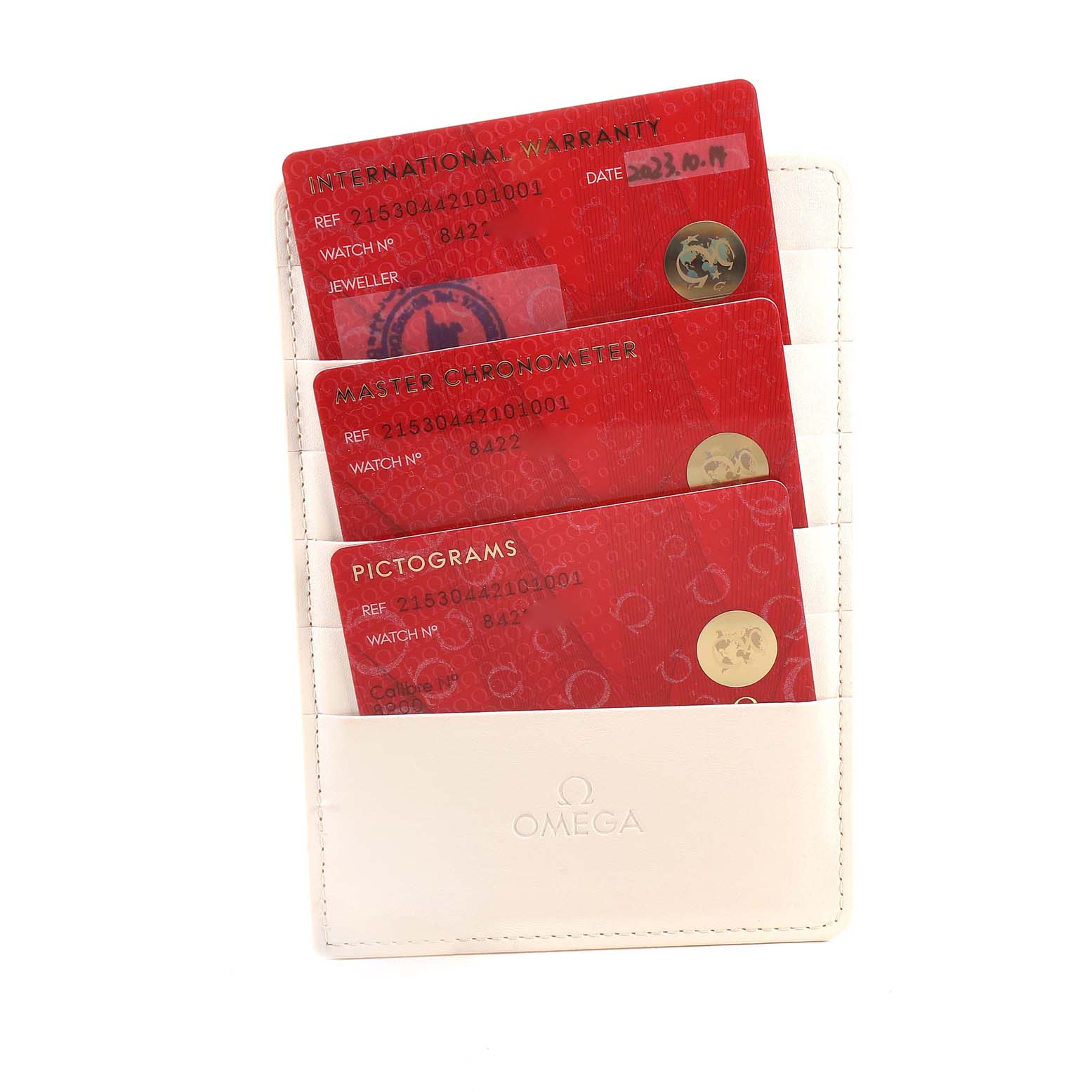 This image shows warranty and certification cards for the Omega Planet Ocean 215.30.44.21.01.001 Men
s Stainless Steel Black Dial 215.30.44.21.01.001 Men
s Stainless Steel Black Dial model held in a white Omega cardholder.