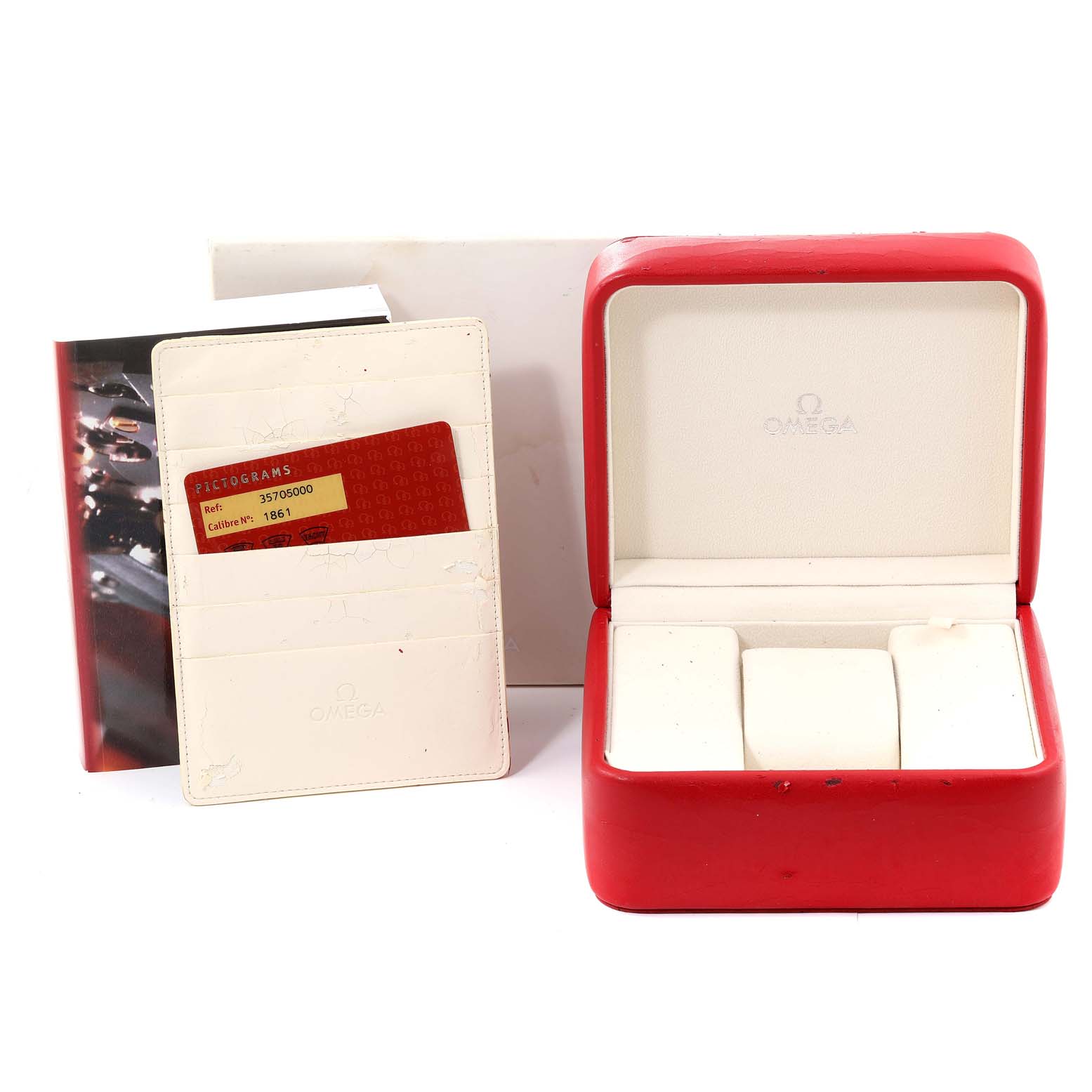 The image shows a red Omega Speedmaster 3570.50.00 Men's Stainless Steel Black Dial 3570.50.00 Men's Stainless Steel Black Dial watch box, a certificate holder with a card, and a booklet from a front angle.