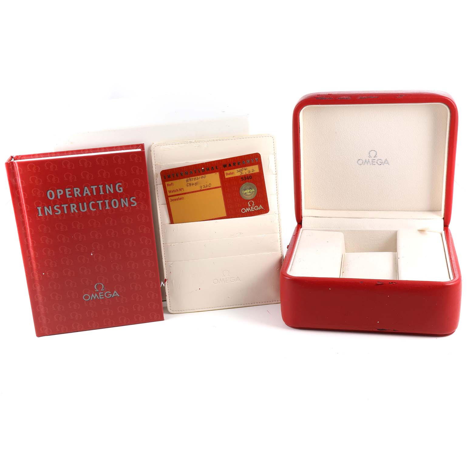 The image shows a red Omega Speedmaster 3510.21.00 Men's Stainless Steel Silver Dial 3510.21.00 Men's Stainless Steel Silver Dial operating instructions booklet, a warranty card, and a red watch box.