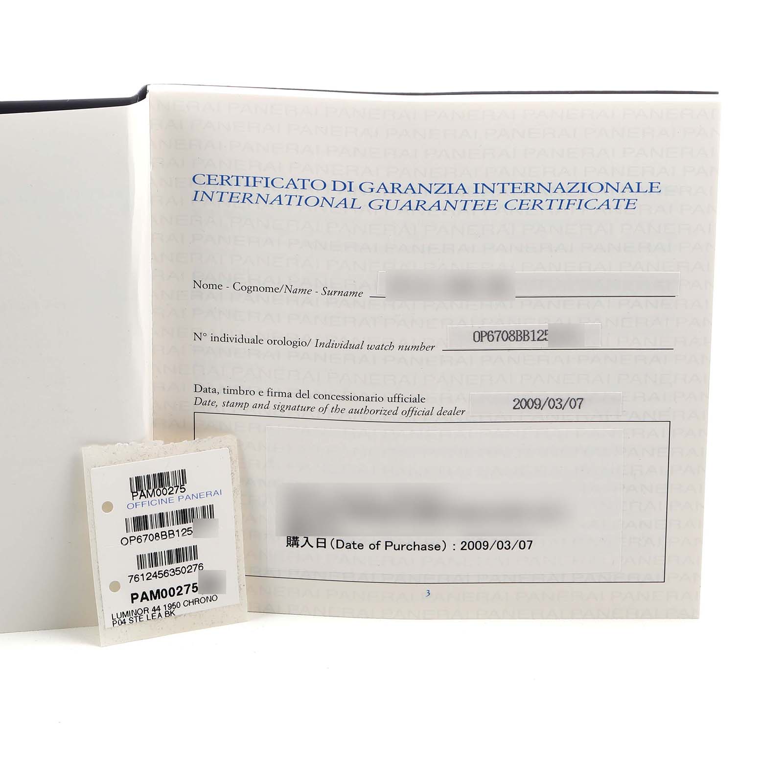 The image shows a Panerai Luminor PAM00275 Men's Stainless Steel Black Dial guarantee certificate and barcode tag from an angle that displays the paperwork details.