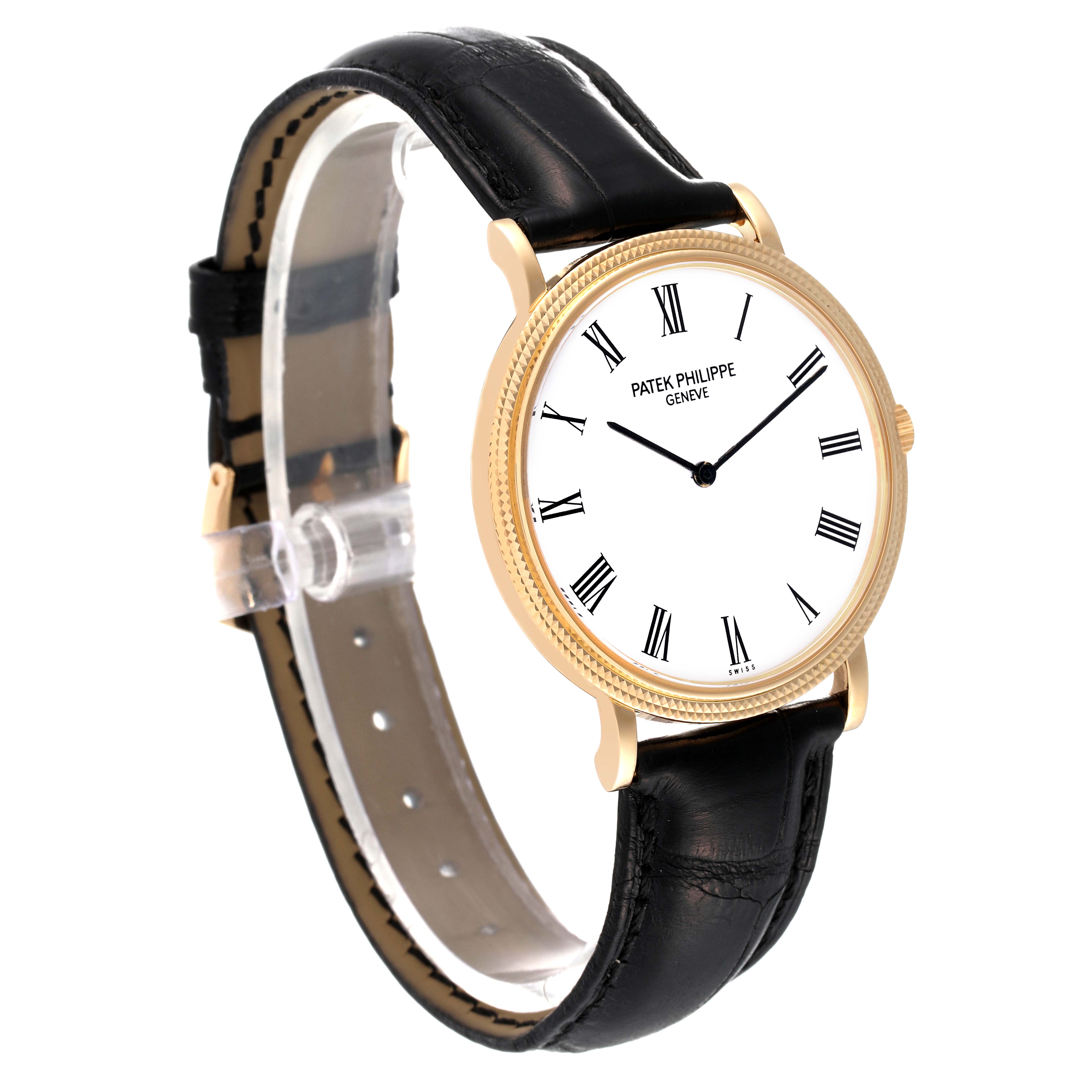 The Patek Philippe Calatrava 5120J Men's Yellow Gold White Dial 5120J Men's Yellow Gold White Dial watch is shown from a three-quarter angle, featuring the dial, bezel, and leather strap.