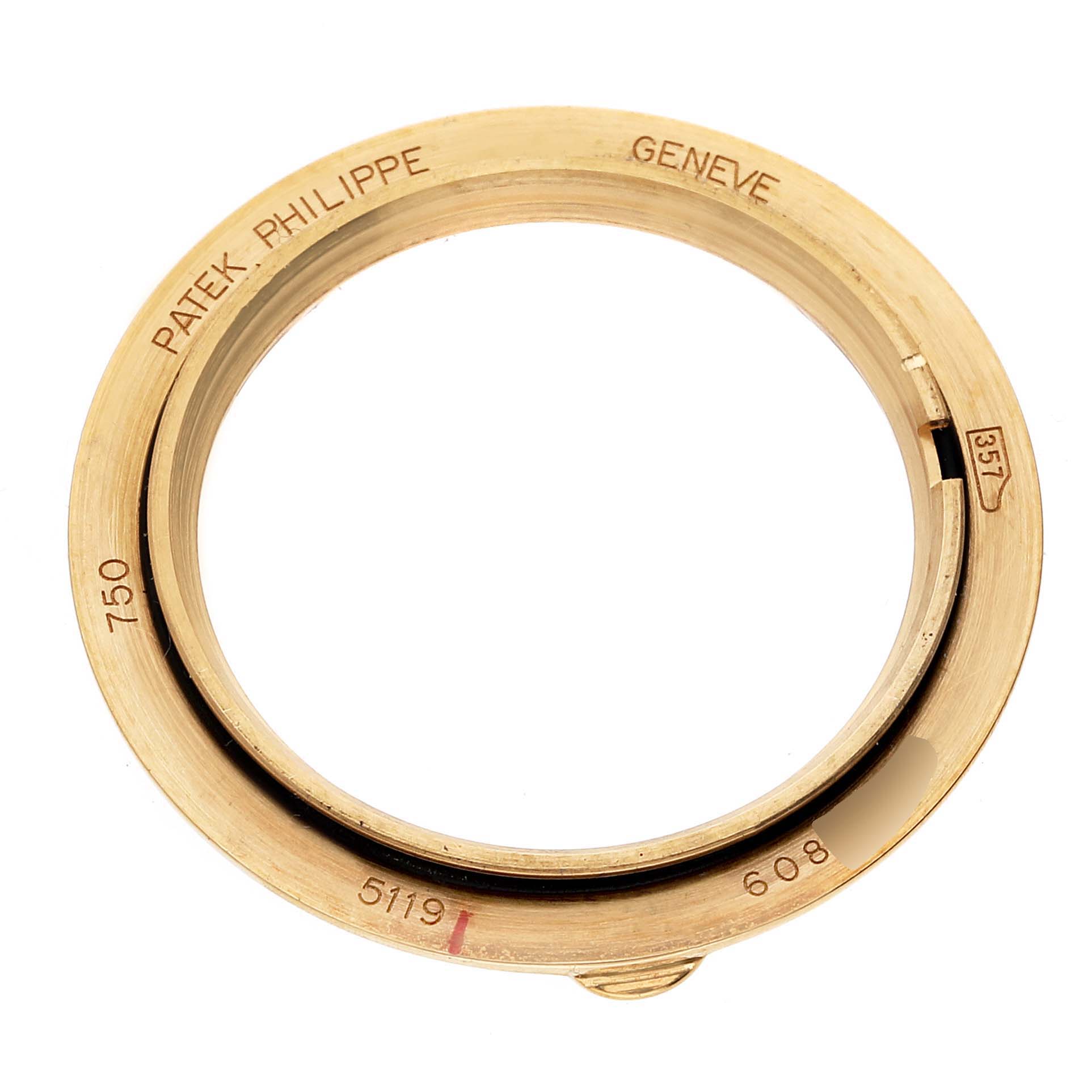 The image shows the bezel of a Patek Philippe Calatrava 5119J Men
s Yellow Gold White Dial 5119J Men
s Yellow Gold White Dial model watch.