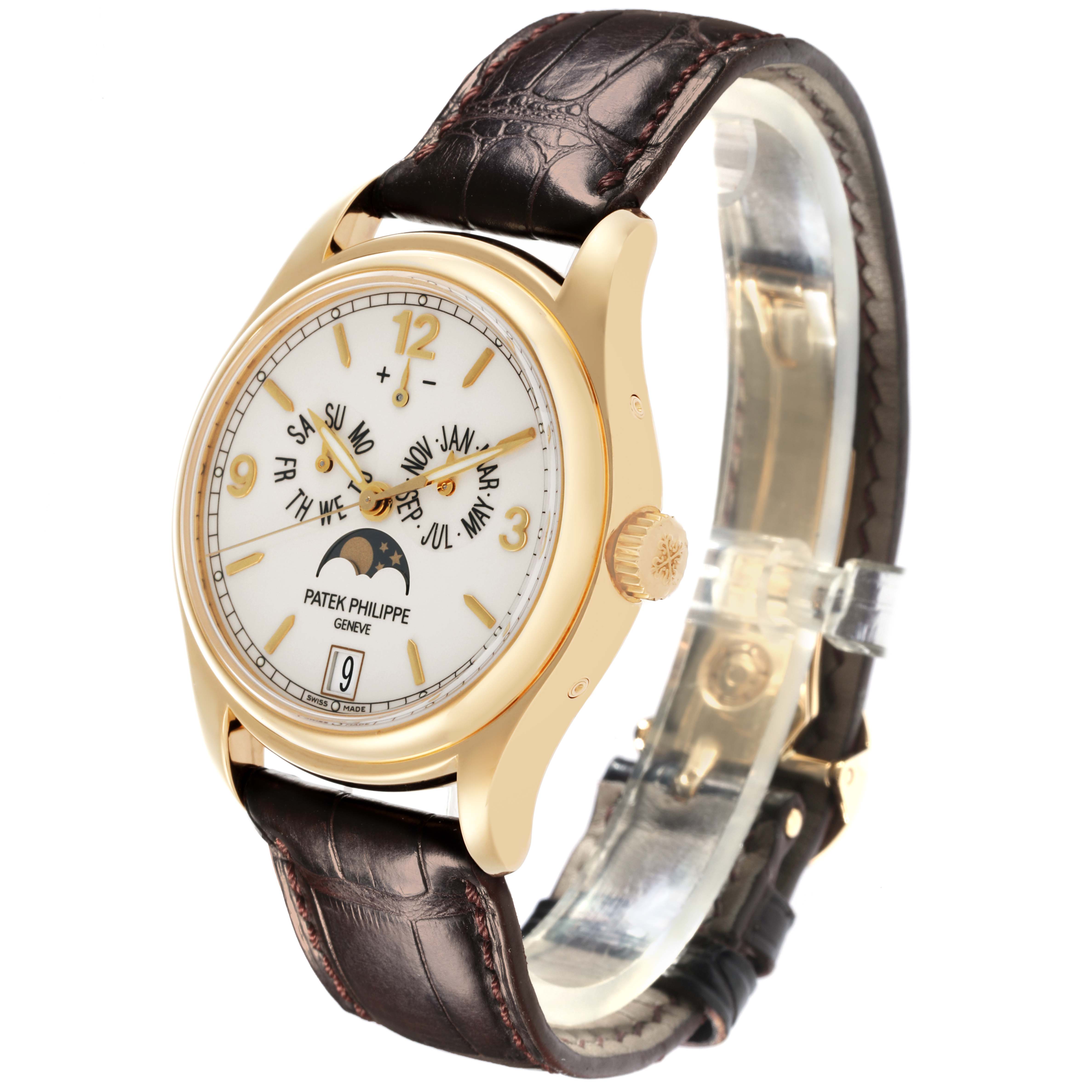The image shows a Patek Philippe Complications 5146J-001 Men's Yellow Gold White Dial 5146J-001 Men's Yellow Gold White Dial watch at a three-quarter angle, highlighting the dial, crown, and strap.