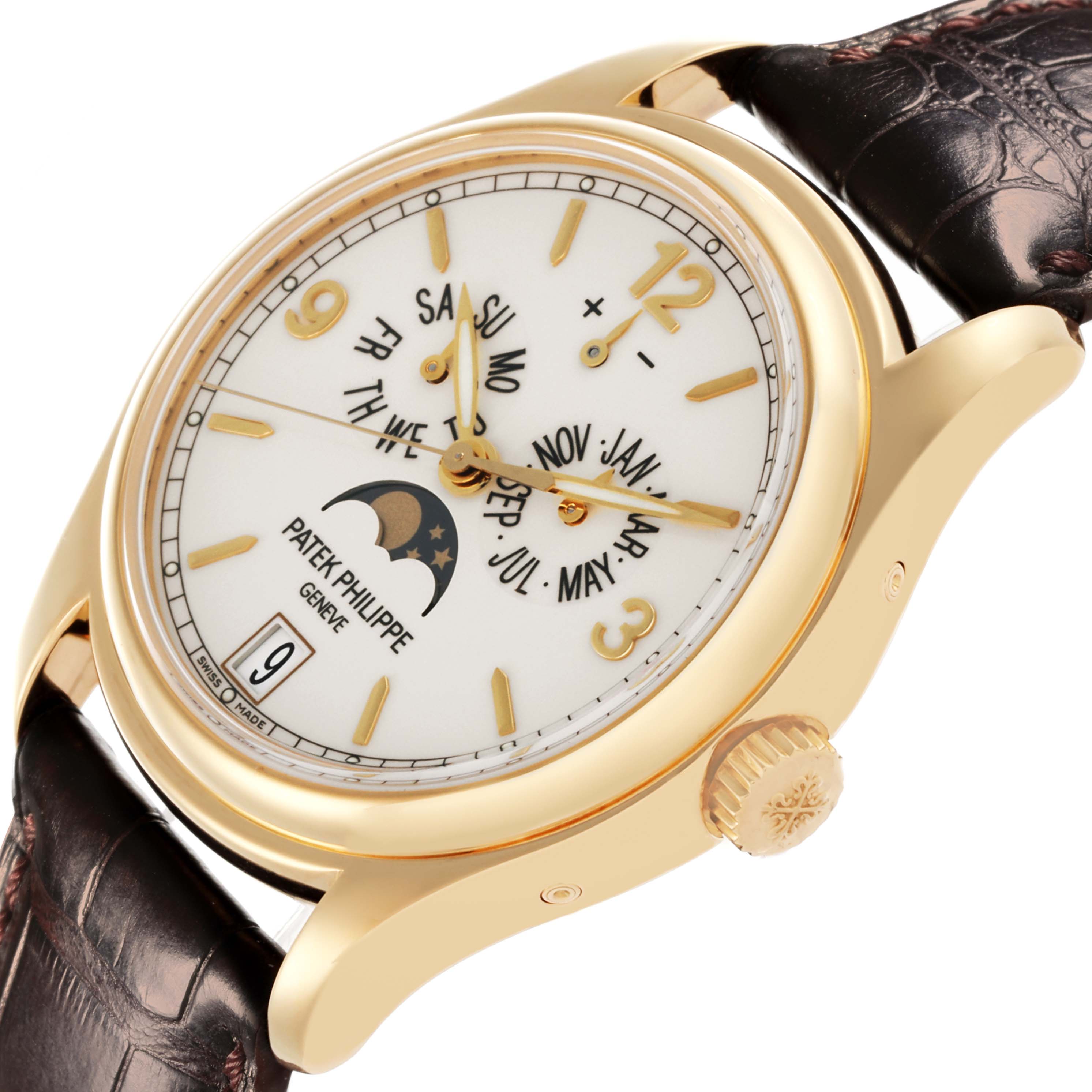 The Patek Philippe Complications 5146J-001 Men's Yellow Gold White Dial 5146J-001 Men's Yellow Gold White Dial watch is shown in a side angle, highlighting its dial, crown, and leather strap.