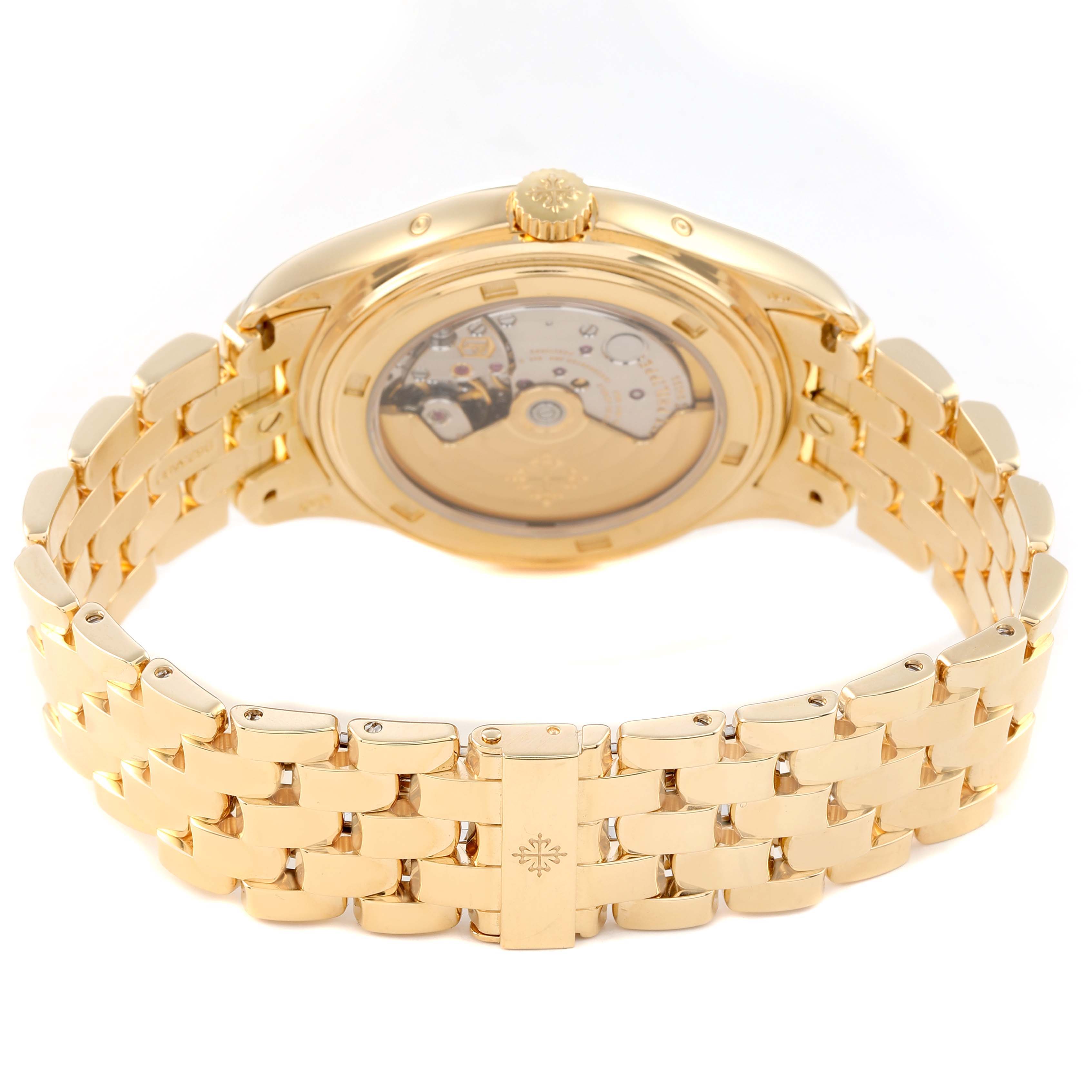 The image shows a rear view of the Patek Philippe Complications 5146/1J-001 Men's Yellow Gold White Dial watch, highlighting the open case back and gold bracelet.