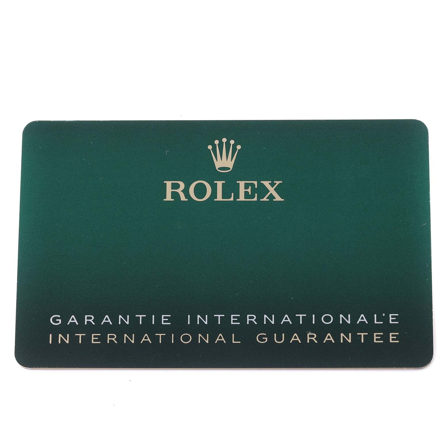 The image shows a Rolex international guarantee card for the 1908 model, featuring the brand logo and text on a green background.