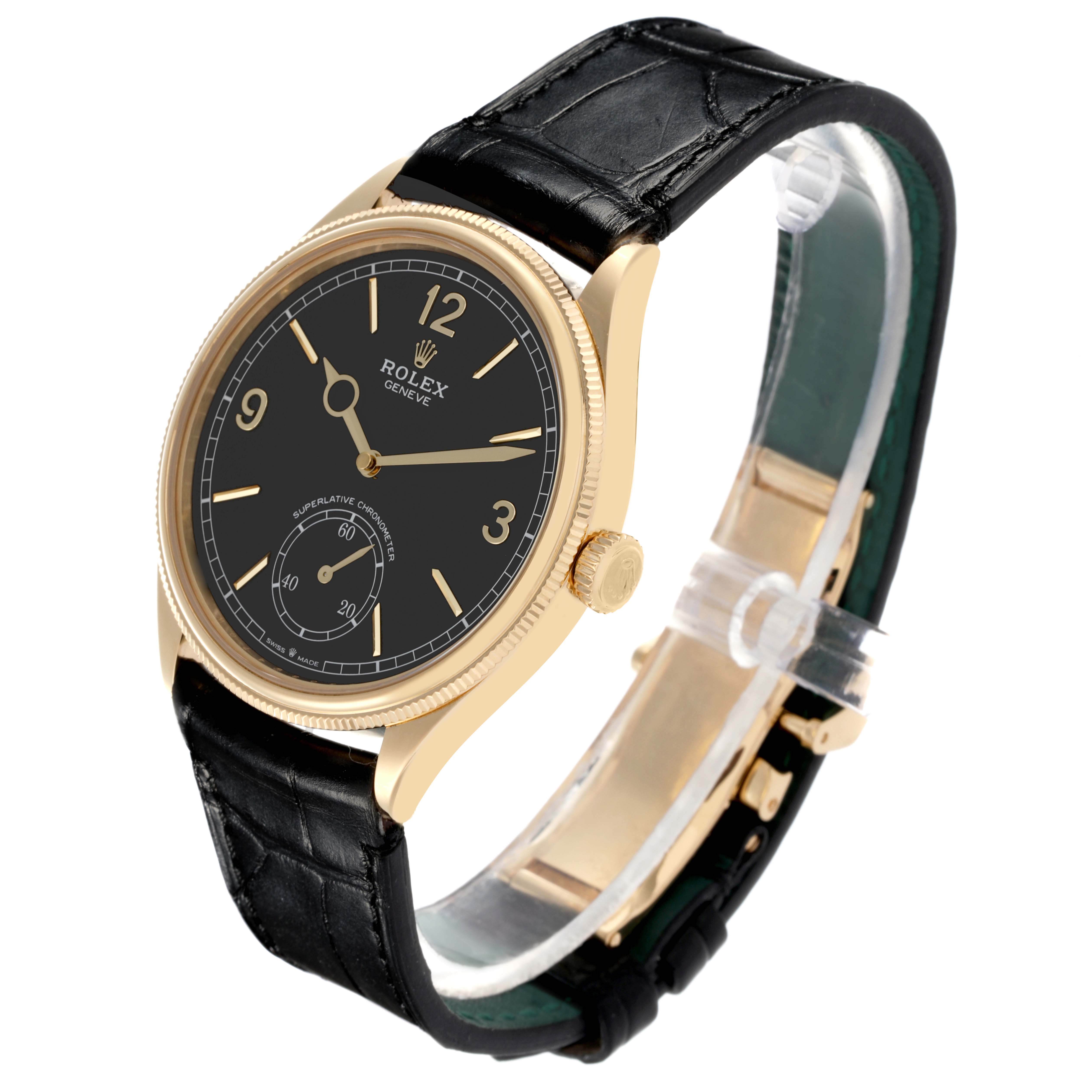 The Rolex 1908 52508-0002 Men's Yellow Gold Black Dial 52508-0002 Men's Yellow Gold Black Dial watch is shown at a three-quarter angle, highlighting the dial, case, crown, and leather strap.