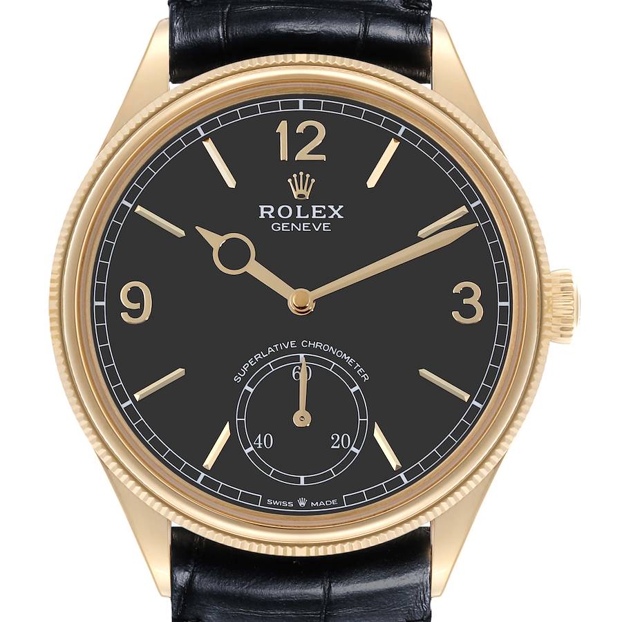 The image displays a front view of the Rolex 1908 watch, showing its black dial, gold numerals, and leather strap.