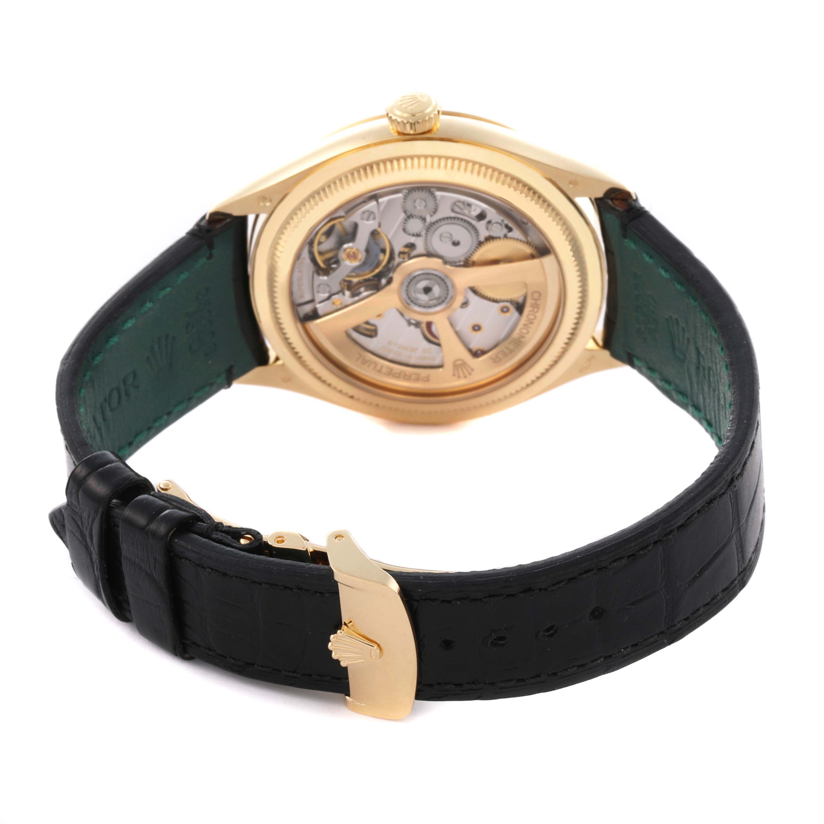 The Rolex 1908 52508-0002 Men's Yellow Gold Black Dial 52508-0002 Men's Yellow Gold Black Dial model is shown from the back, highlighting the movement and leather strap.