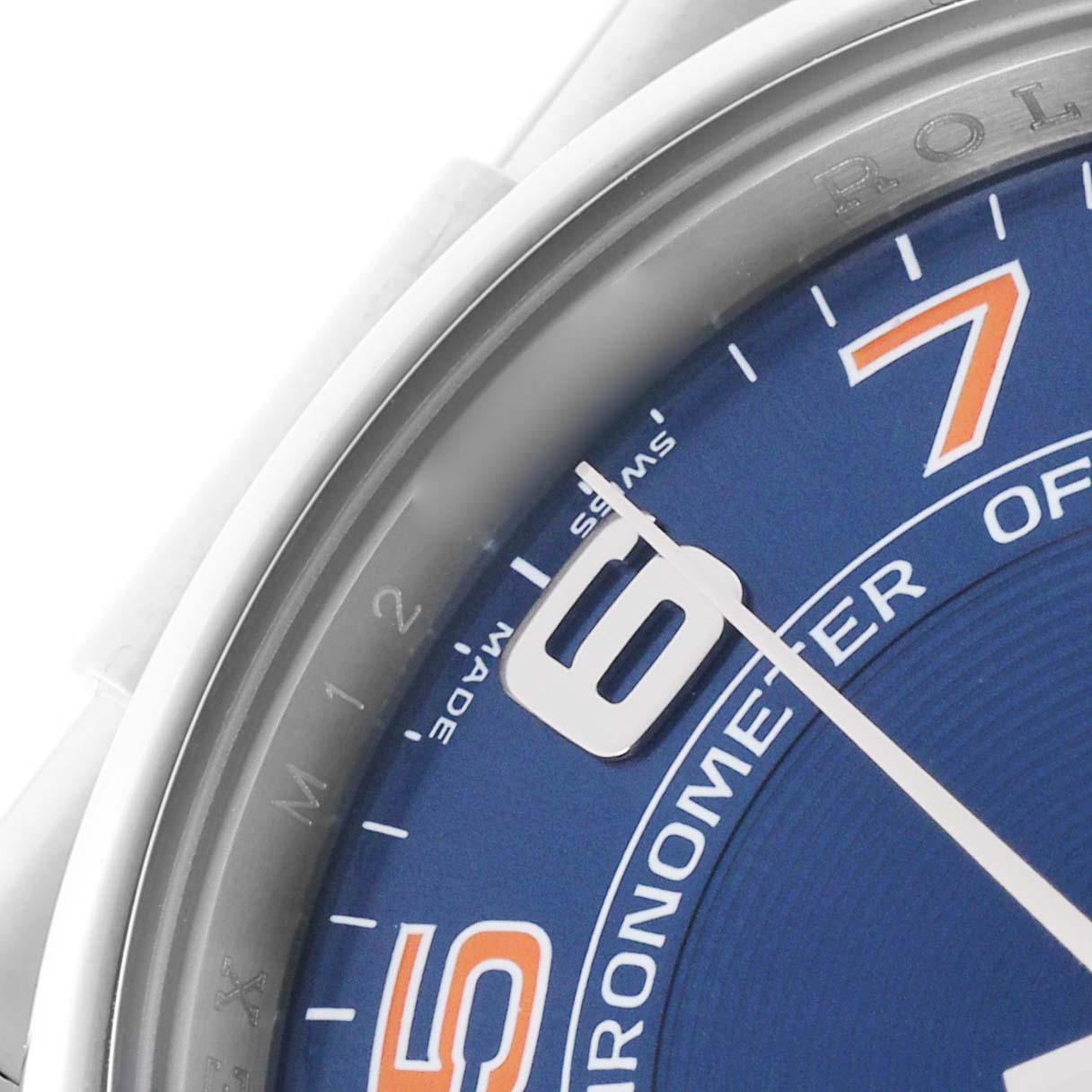 The image shows a close-up of the dial of a Rolex Air-King 114200 Men's Stainless Steel Blue Dial 114200 Men's Stainless Steel Blue Dial, focusing on the numerals and minute markers.