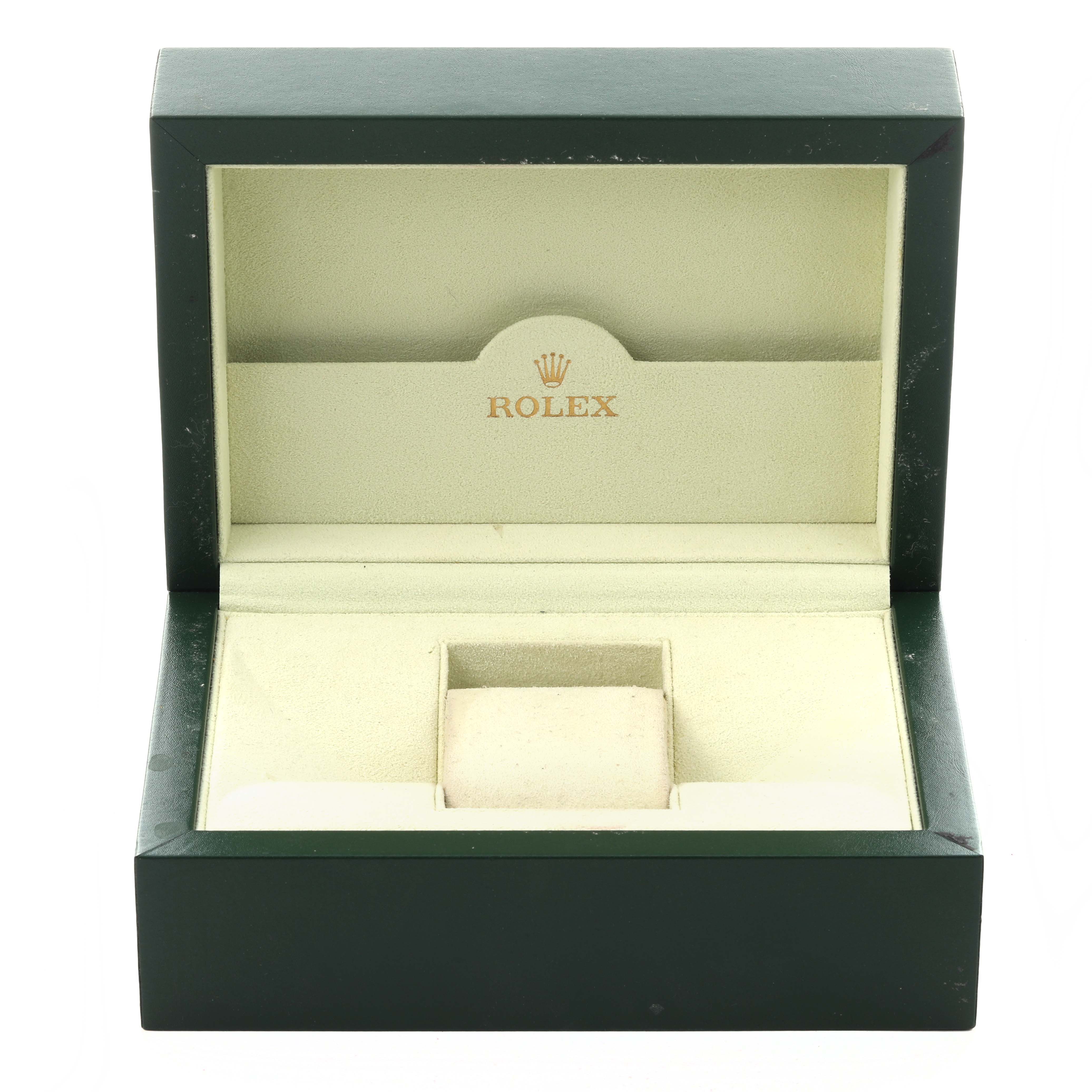 The image shows an open Rolex watch box for the Air-King model, displaying its interior lined with green and beige materials.