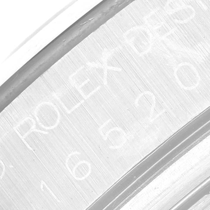 This close-up image shows the engraved inner bezel of the Rolex Daytona 16520 Men's Stainless Steel Black Dial 16520 Men's Stainless Steel Black Dial watch.