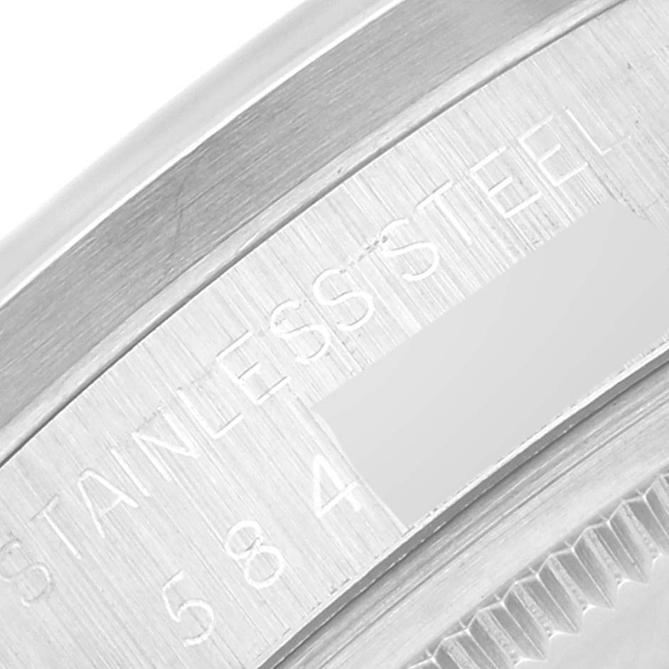 The image shows a close-up of the stainless steel case back with engravings on a Vintage Collection model by Rolex.