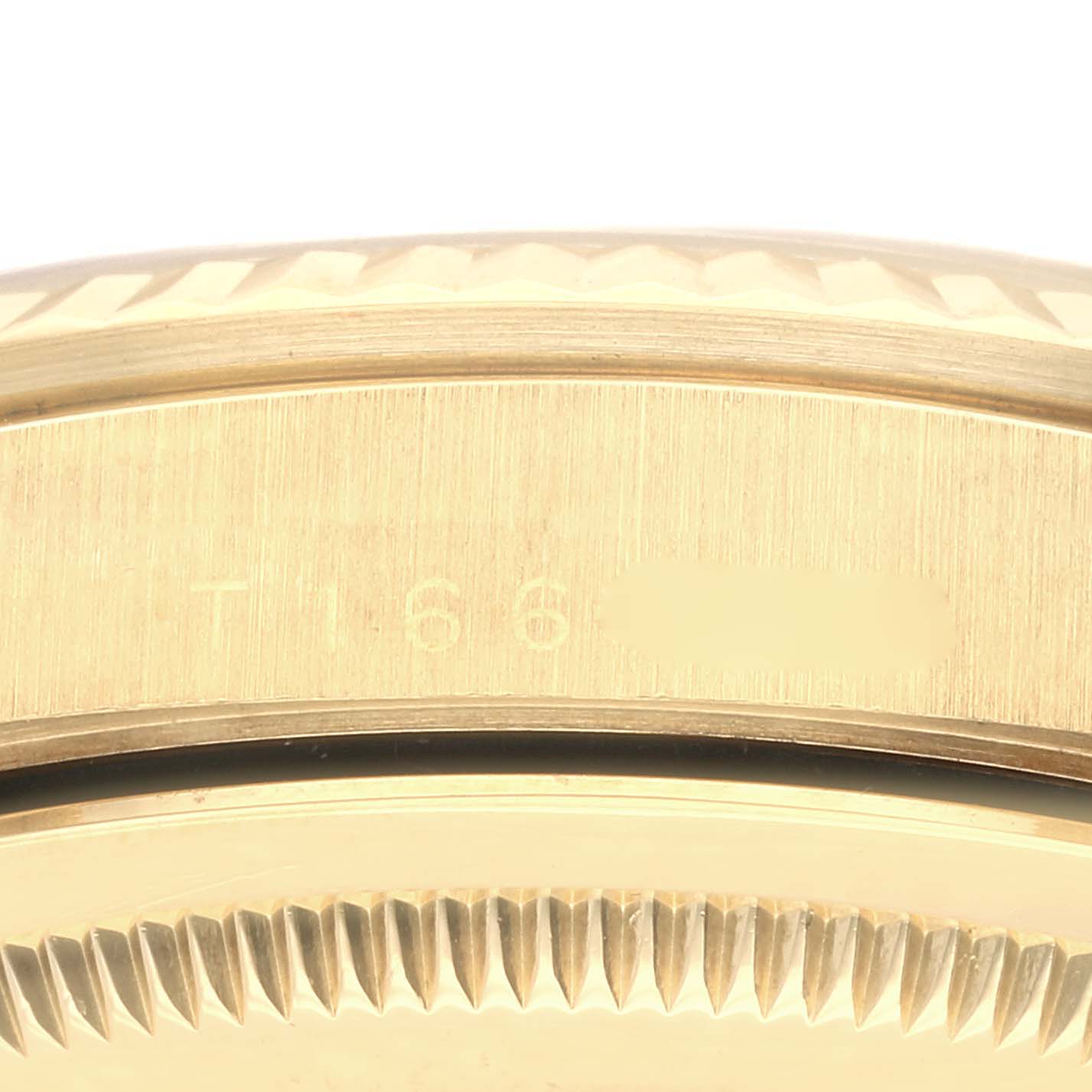 This image shows the close-up of the side casing and serrated bezel of a Rolex Datejust 16238 Men's Yellow Gold Champagne Dial 16238 Men's Yellow Gold Champagne Dial watch.