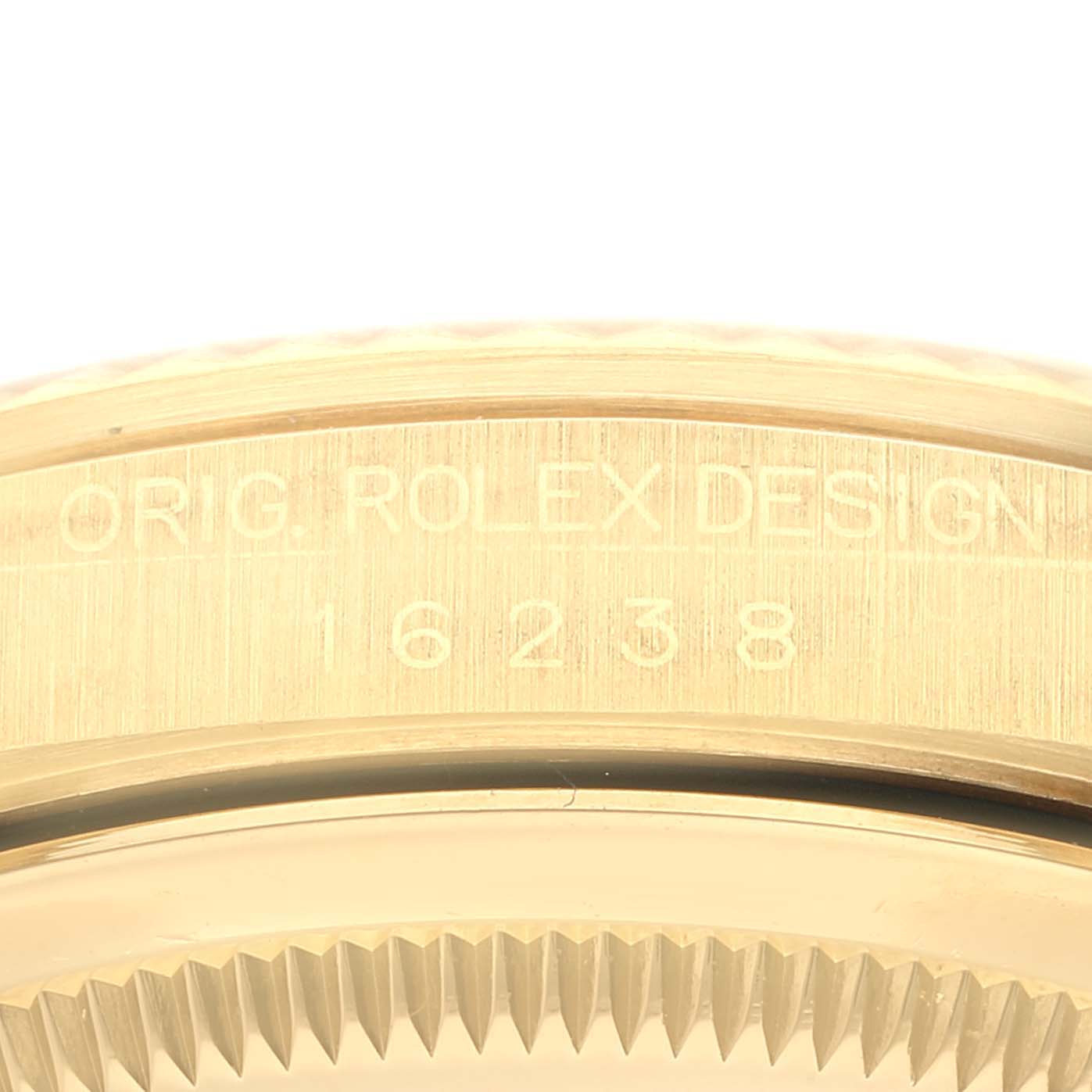 The image shows a close-up of the case back engraving of a Rolex Datejust 16238 Men's Yellow Gold Champagne Dial 16238 Men's Yellow Gold Champagne Dial, model number 16238.