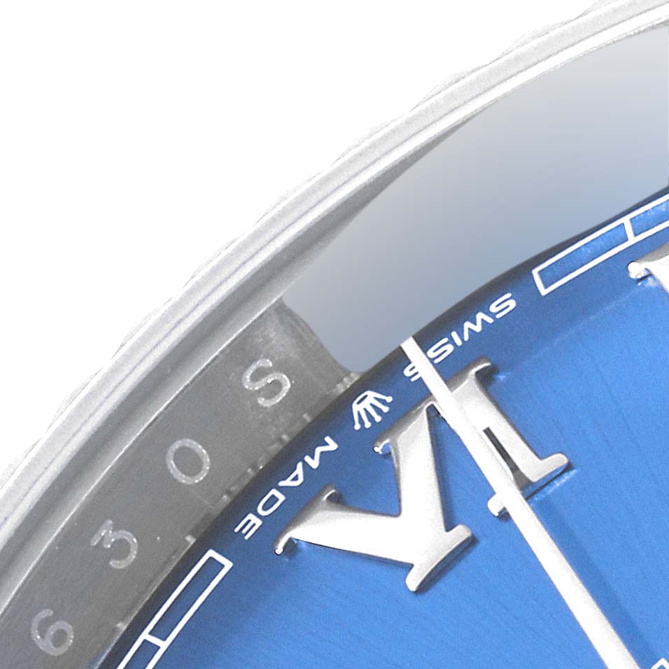 This image shows a close-up of the dial and bezel of a Rolex Datejust 41 126334 Men's Stainless Steel Blue Dial 126334 Men's Stainless Steel Blue Dial watch, highlighting the "Swiss Made" text and Roman numerals.