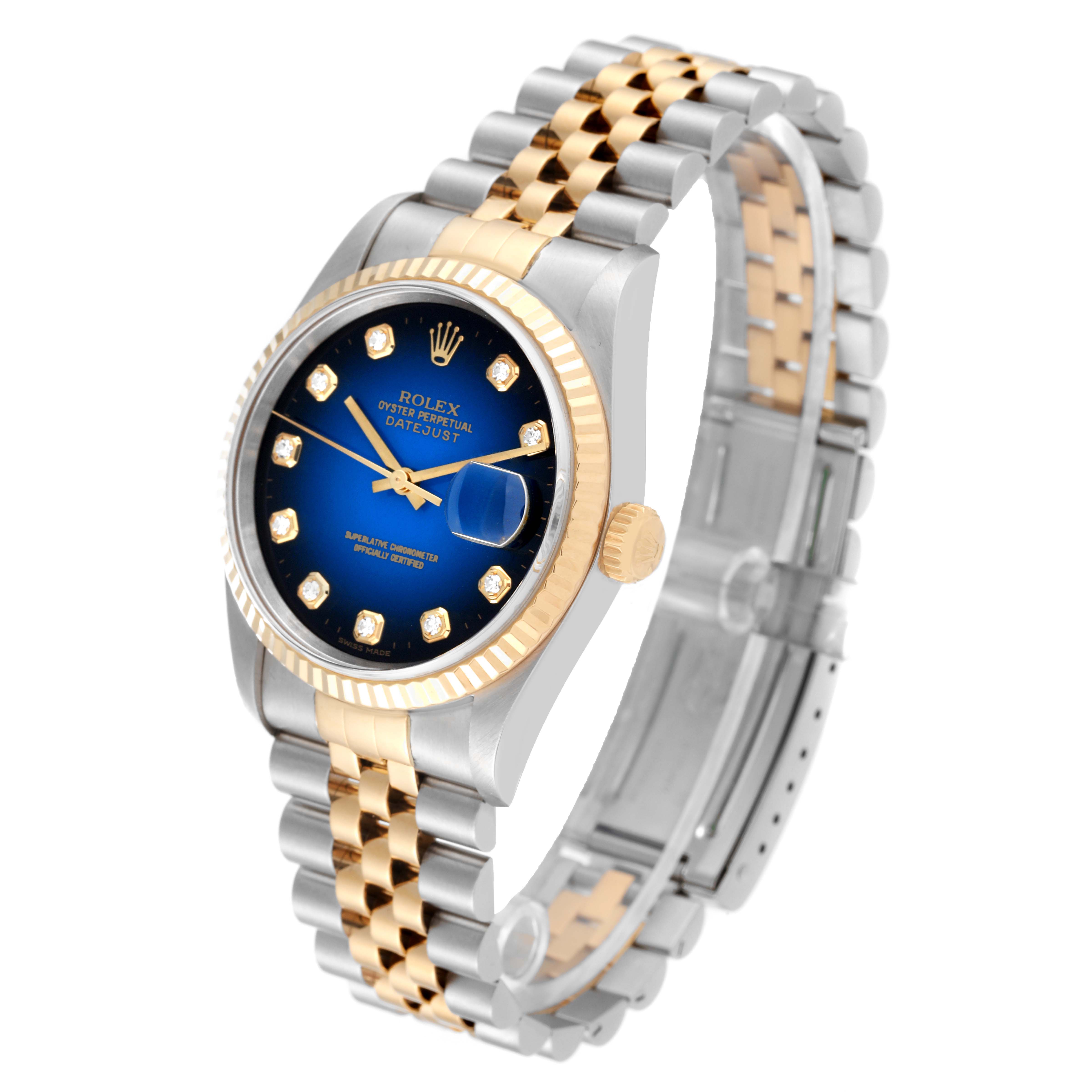This image shows a side-angle view of a Rolex Datejust 16233 Men's Steel and Gold (two tone) Blue Dial 16233 Men's Steel and Gold (two tone) Blue Dial watch, featuring its dial, bezel, case, crown, and two-tone bracelet.