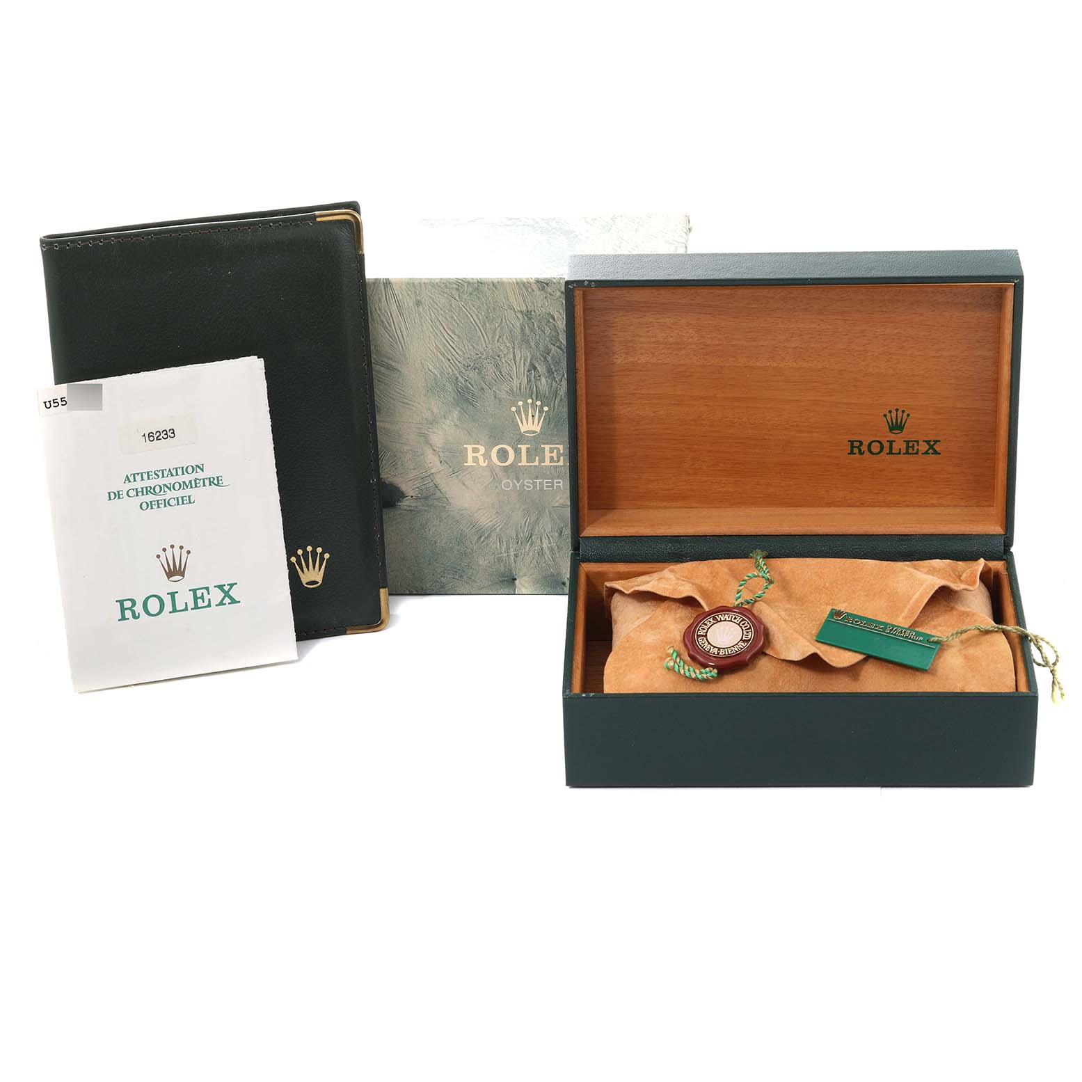 Image shows a Rolex Datejust 16233 Men's Steel and Gold (two tone) Blue Dial 16233 Men's Steel and Gold (two tone) Blue Dial watch box, documentation, and a pouch with tags, viewed from above.