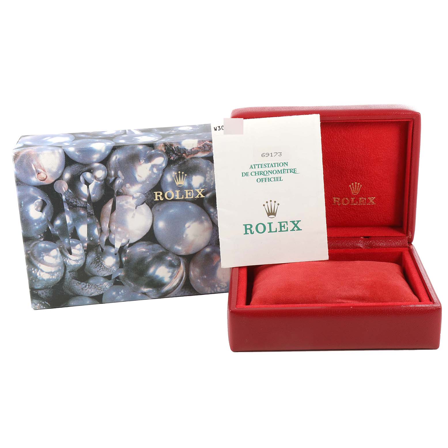 The image shows the packaging for the Rolex Datejust 69173G Women's Steel and Gold (two tone) Champagne Dial 69173G Women's Steel and Gold (two tone) Champagne Dial model, including a decorative box, an official certificate, and a red watch case.
