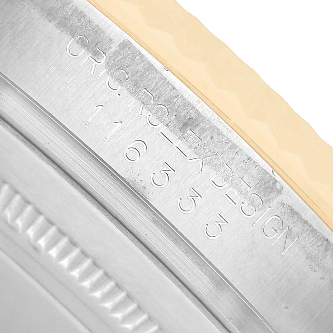 The image shows a close-up of the engraved side of a Rolex Datejust 41 116333 Men's Steel and Gold (two tone) Champagne Dial bezel with serial numbers visible.