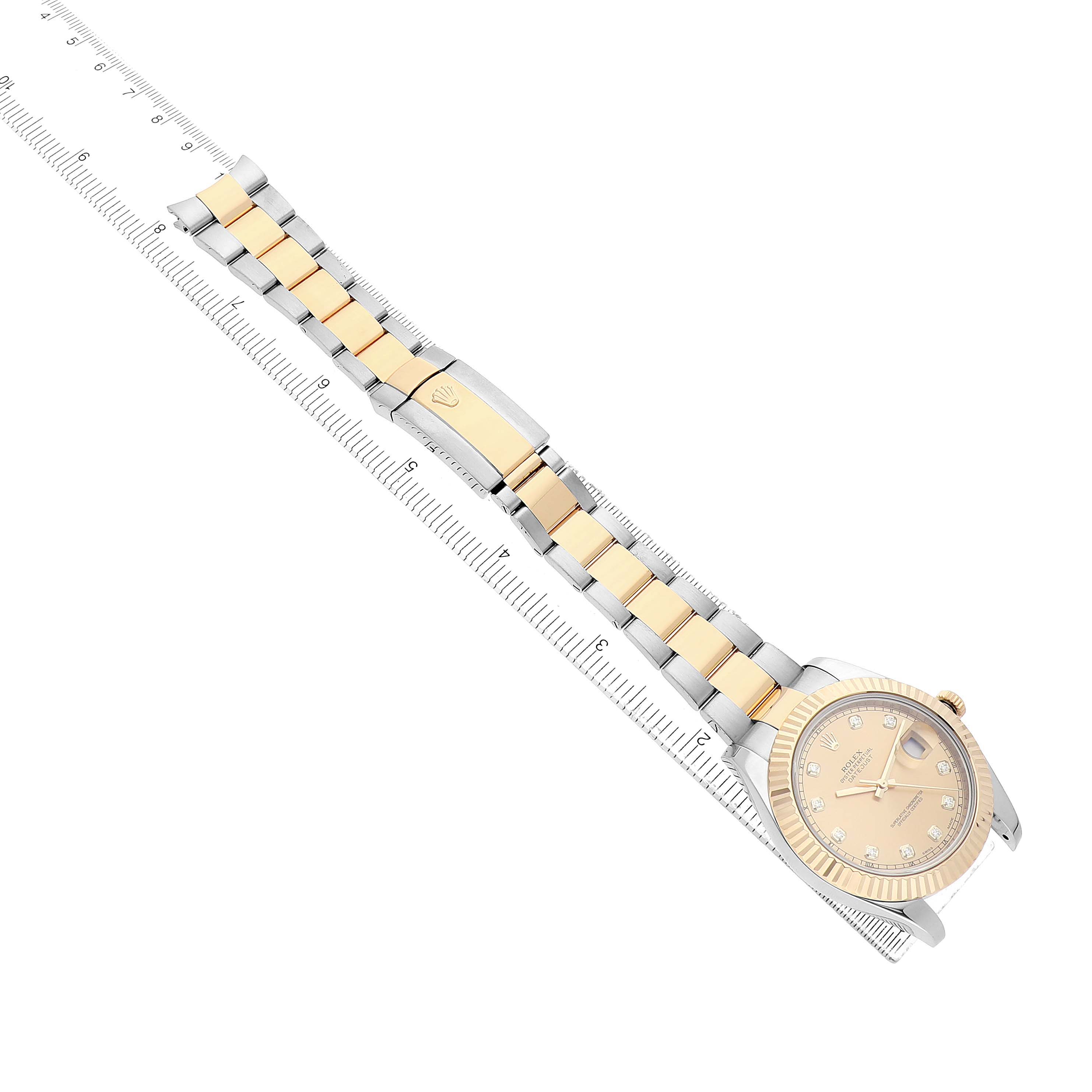 The Rolex Datejust 41 116333 Men's Steel and Gold (two tone) Champagne Dial watch is shown from a top-down angle, featuring its face, bracelet, and clasp aligned with a ruler.