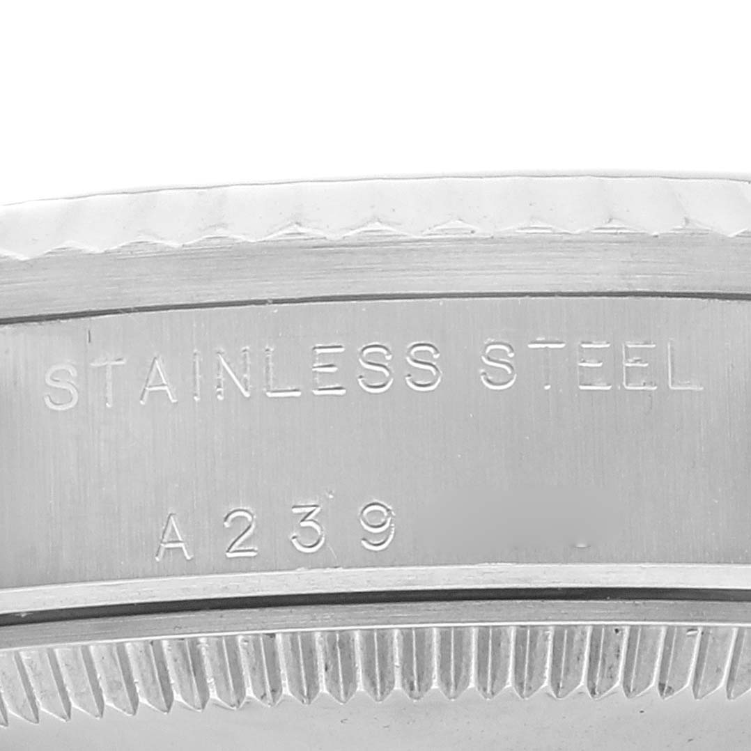 The image shows a close-up view of the stainless steel case back of a Rolex Mid-Size 78274 Women
s Stainless Steel White Dial 78274 Women
s Stainless Steel White Dial model.