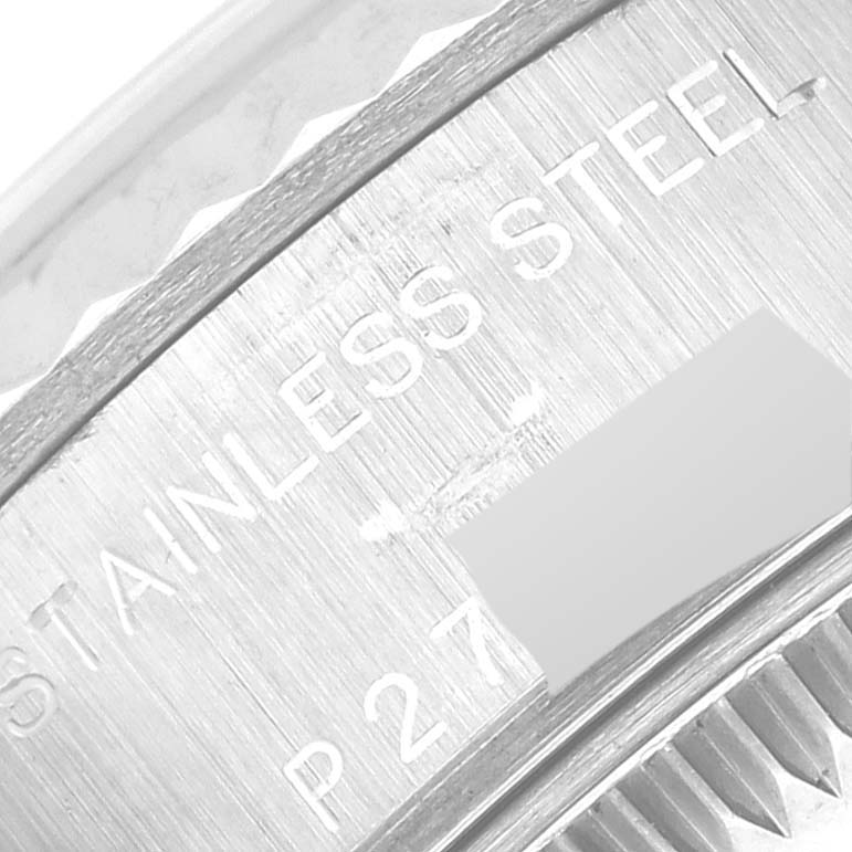 This image shows a close-up of the engraved text on the stainless steel case back of a Rolex Datejust 79174 Women's Stainless Steel White Dial 79174 Women's Stainless Steel White Dial watch.