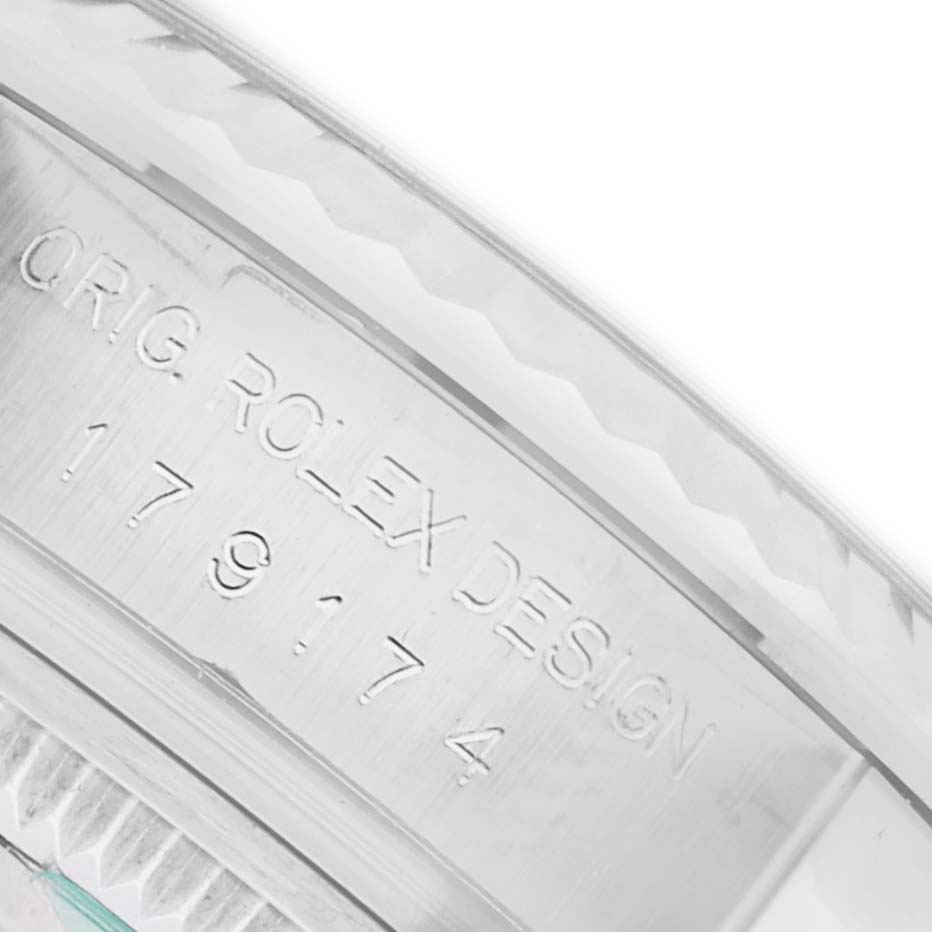 The image shows a close-up of the side engraving on a Rolex Datejust 179174 Women's Stainless Steel Silver Dial 179174 Women's Stainless Steel Silver Dial model, highlighting the "ORIG. ROLEX DESIGN" text and numbers.