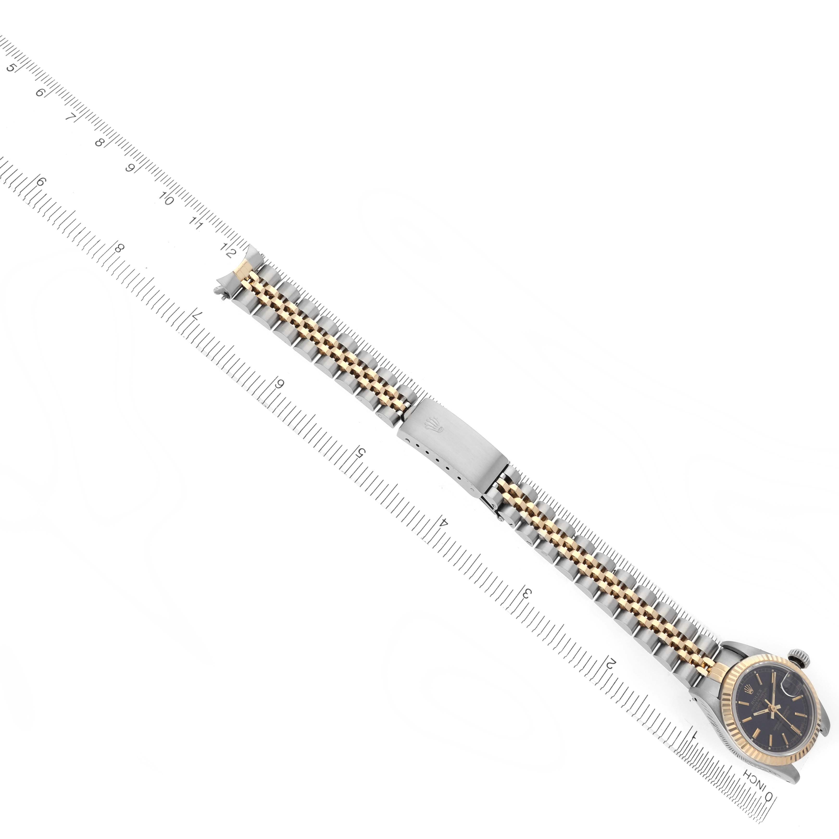 The Rolex Datejust 69173 Women's Steel and Gold (two tone) Black Dial 69173 Women's Steel and Gold (two tone) Black Dial watch is shown from above, displaying the watch face, bracelet, and clasp.