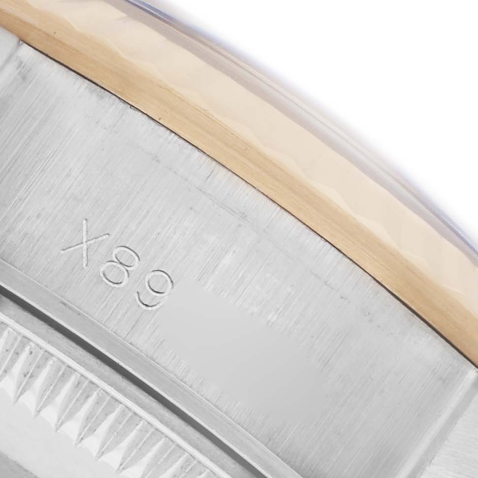 The image shows a close-up of the bezel and case side of a Rolex Datejust 69173 Women's Steel and Gold (two tone) Black Dial 69173 Women's Steel and Gold (two tone) Black Dial watch, highlighting the metal finish and engraved numbers.